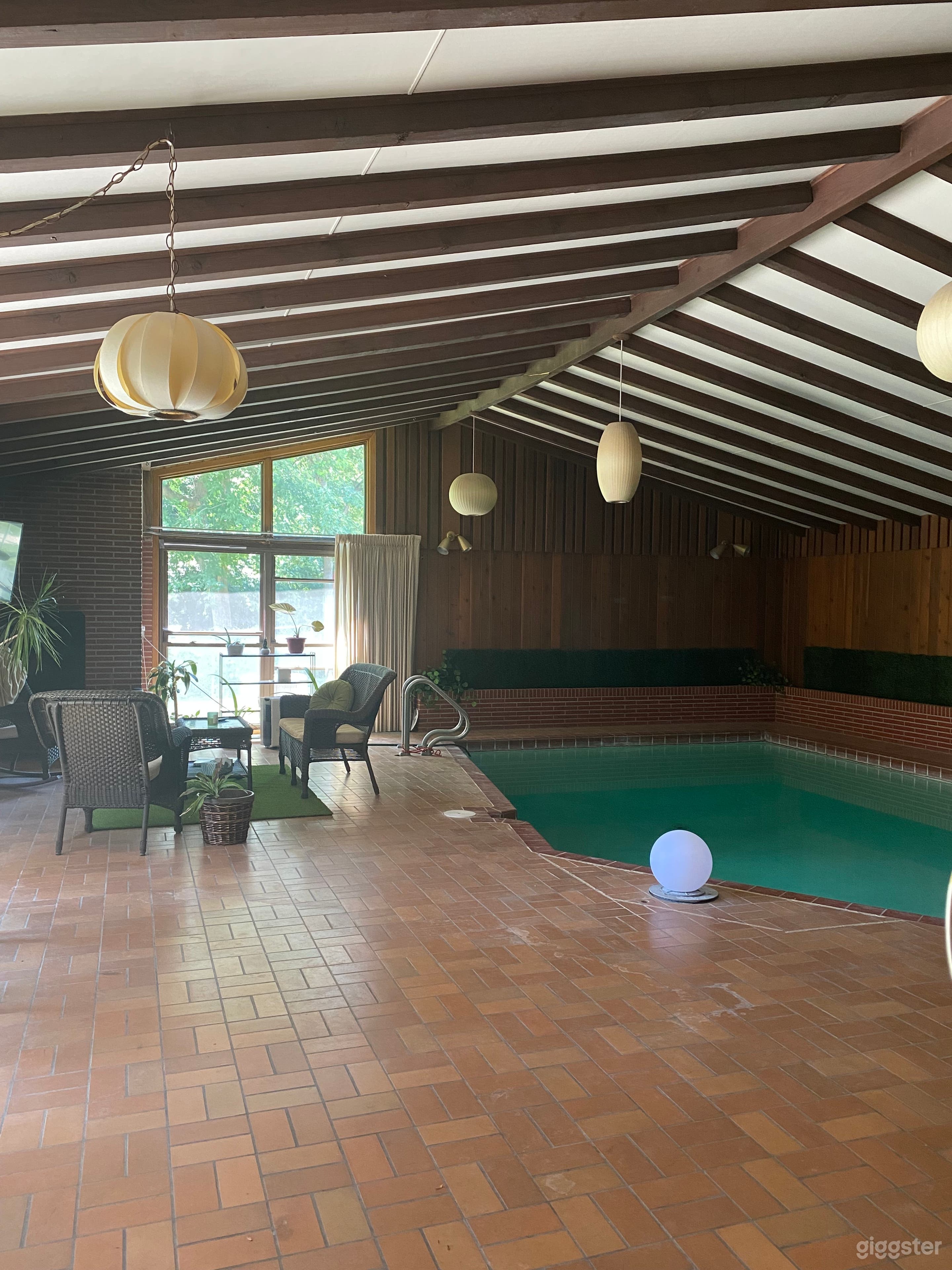 Pool room w/brick wood-burning fireplace and original lights