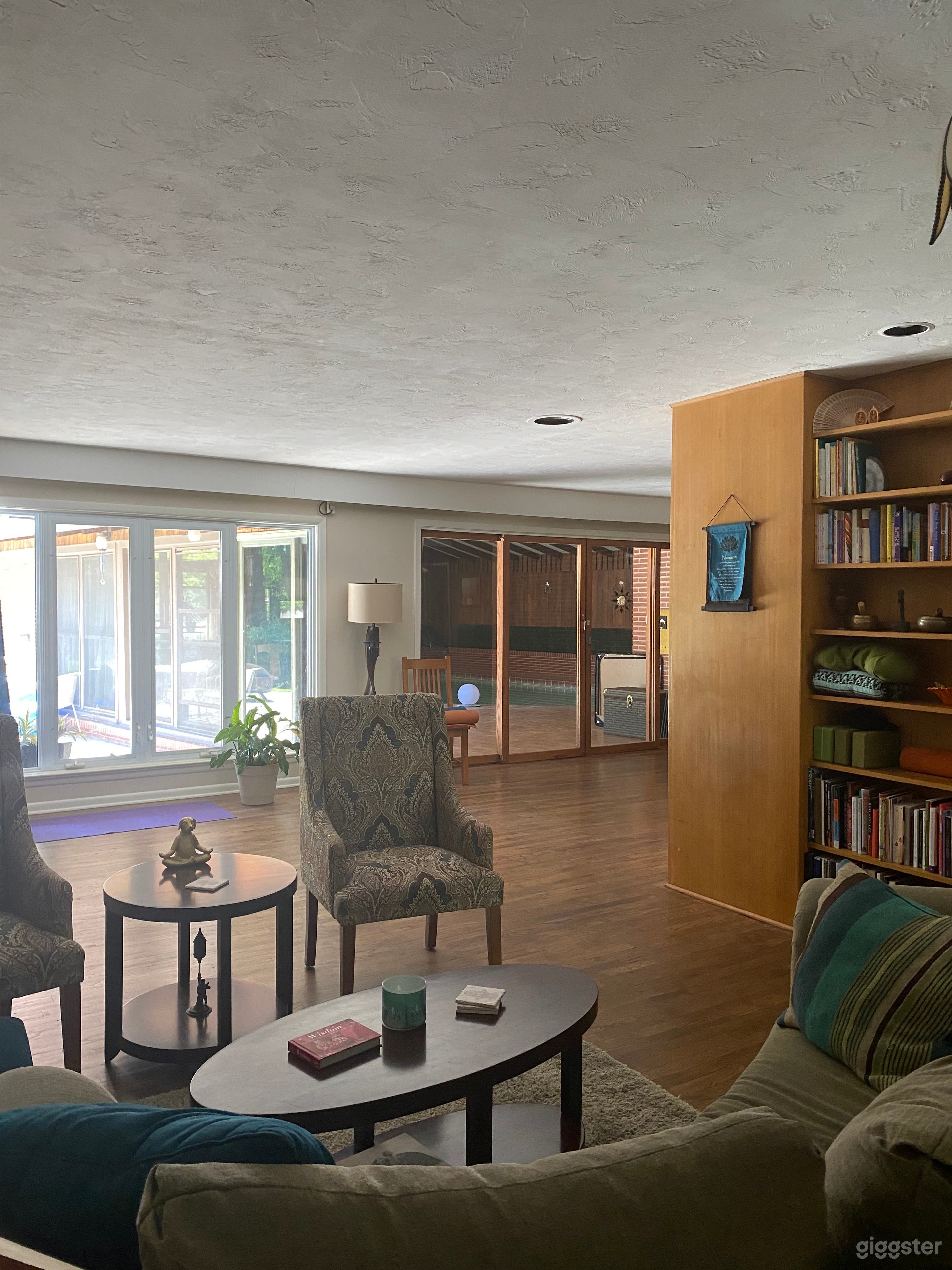 Living room view towards backyard and pool room