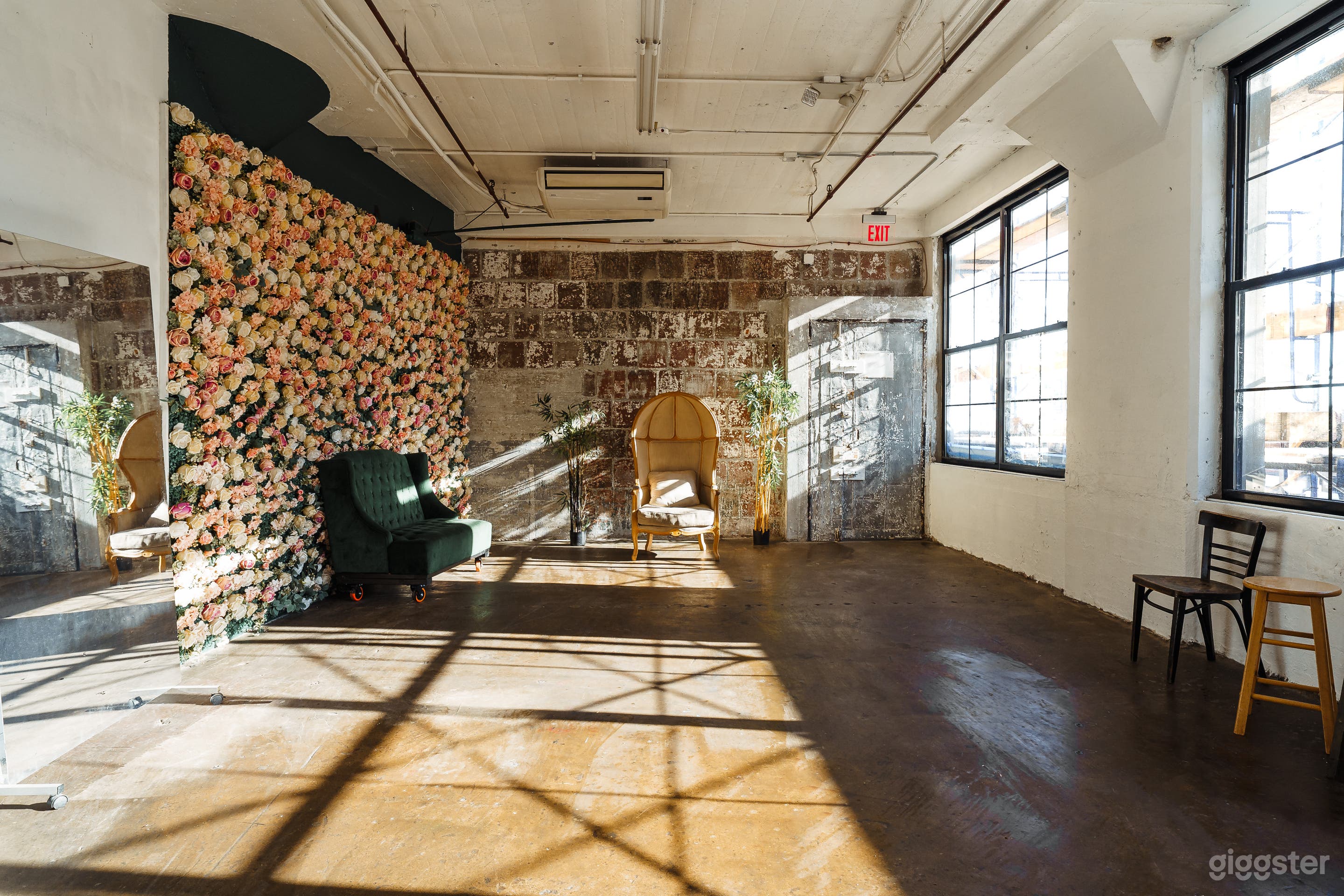 Studio with Flower Wall and Large framed Windows Photo 1