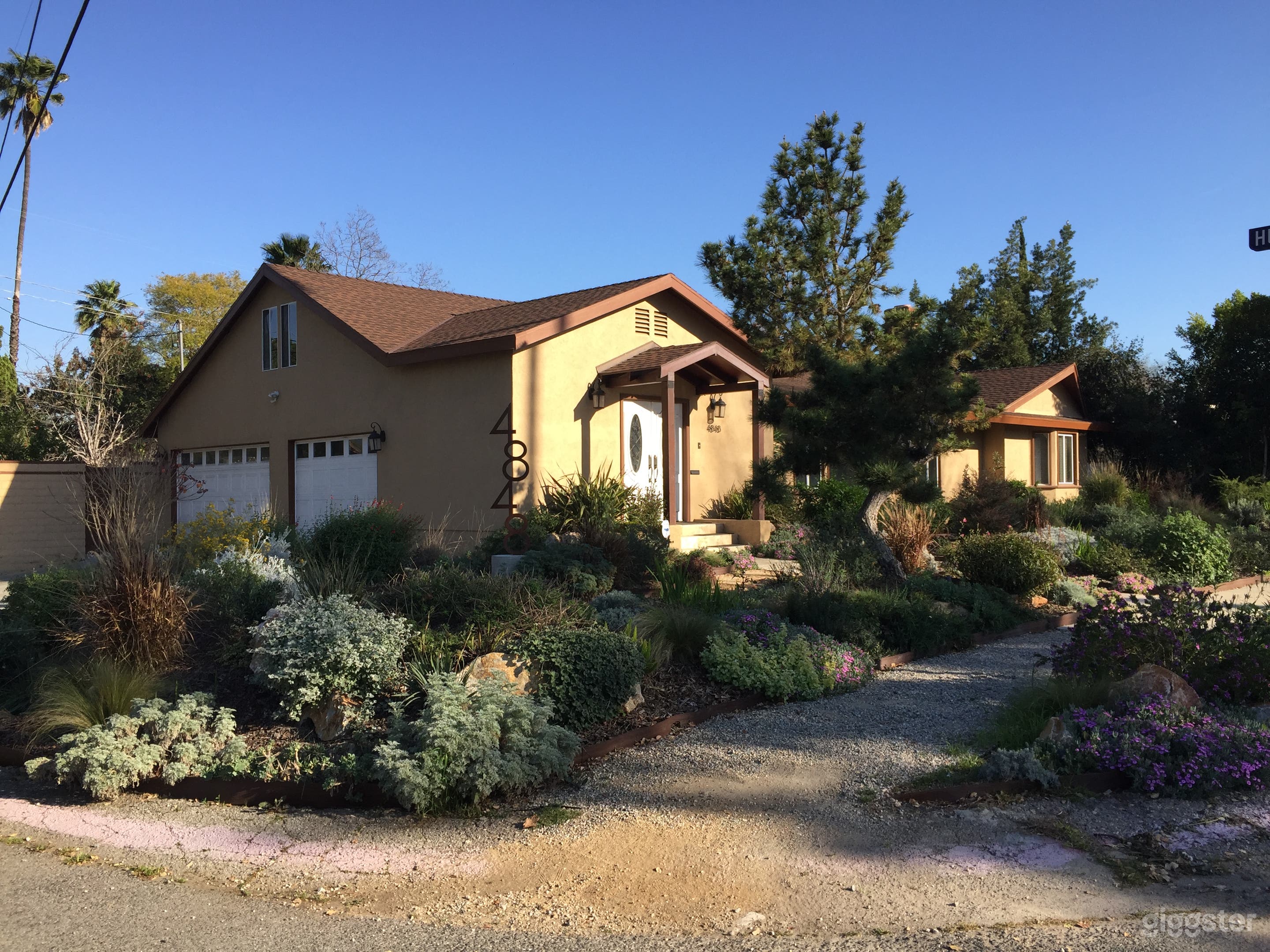Corner lot with lush foliage.
