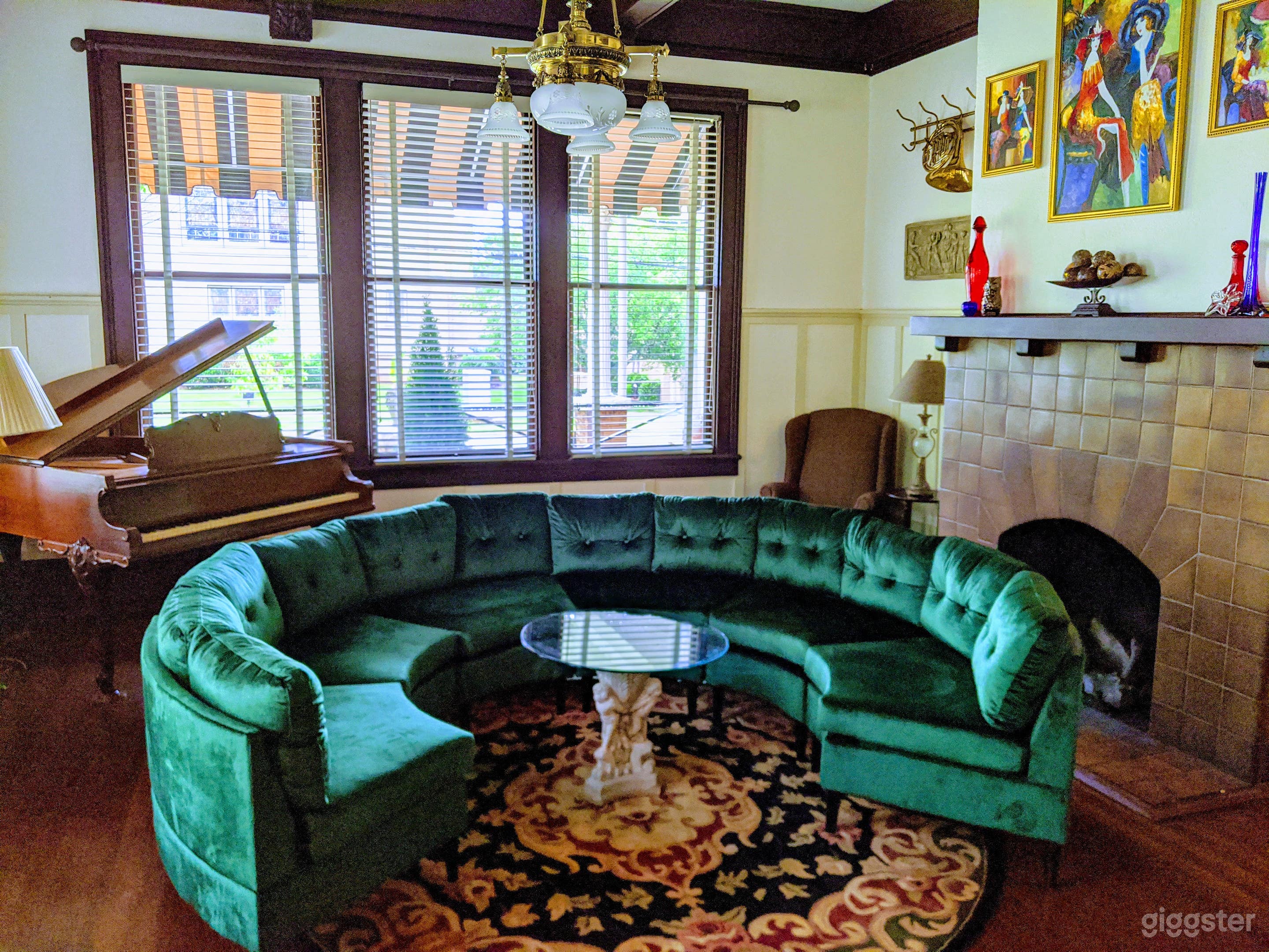 Music room, featuring a working, 1920's baby grand piano and gas log fireplace.