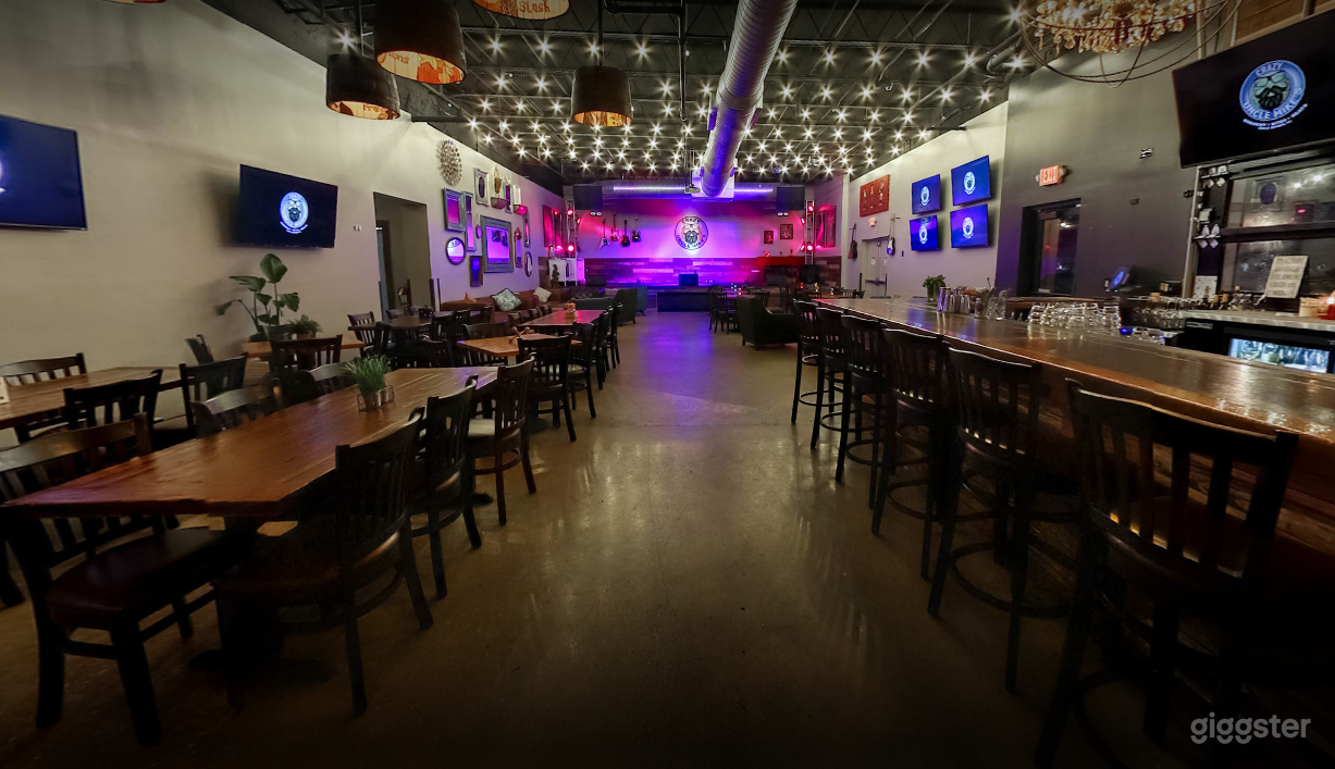 Indoor Dining Space with Bar and Music Stage Photo 1
