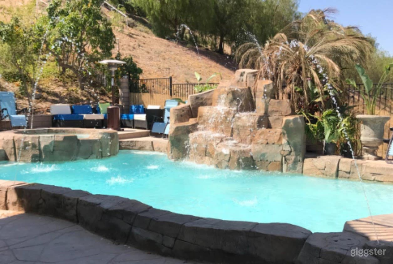 Rock Formation Pool with Heated Spa Photo 1
