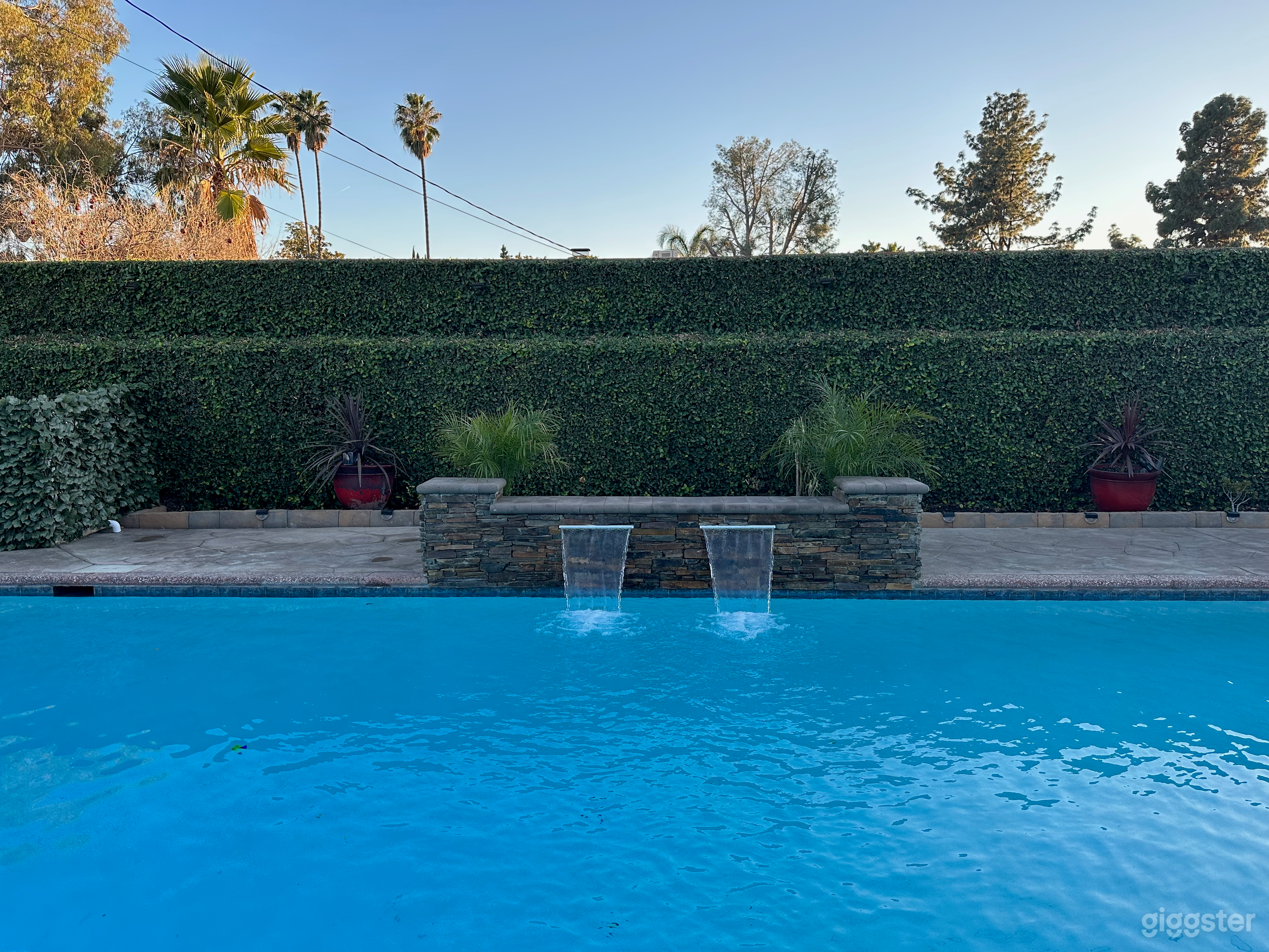 Spacious Outdoor Party Space With Sparkling Pool Photo 2