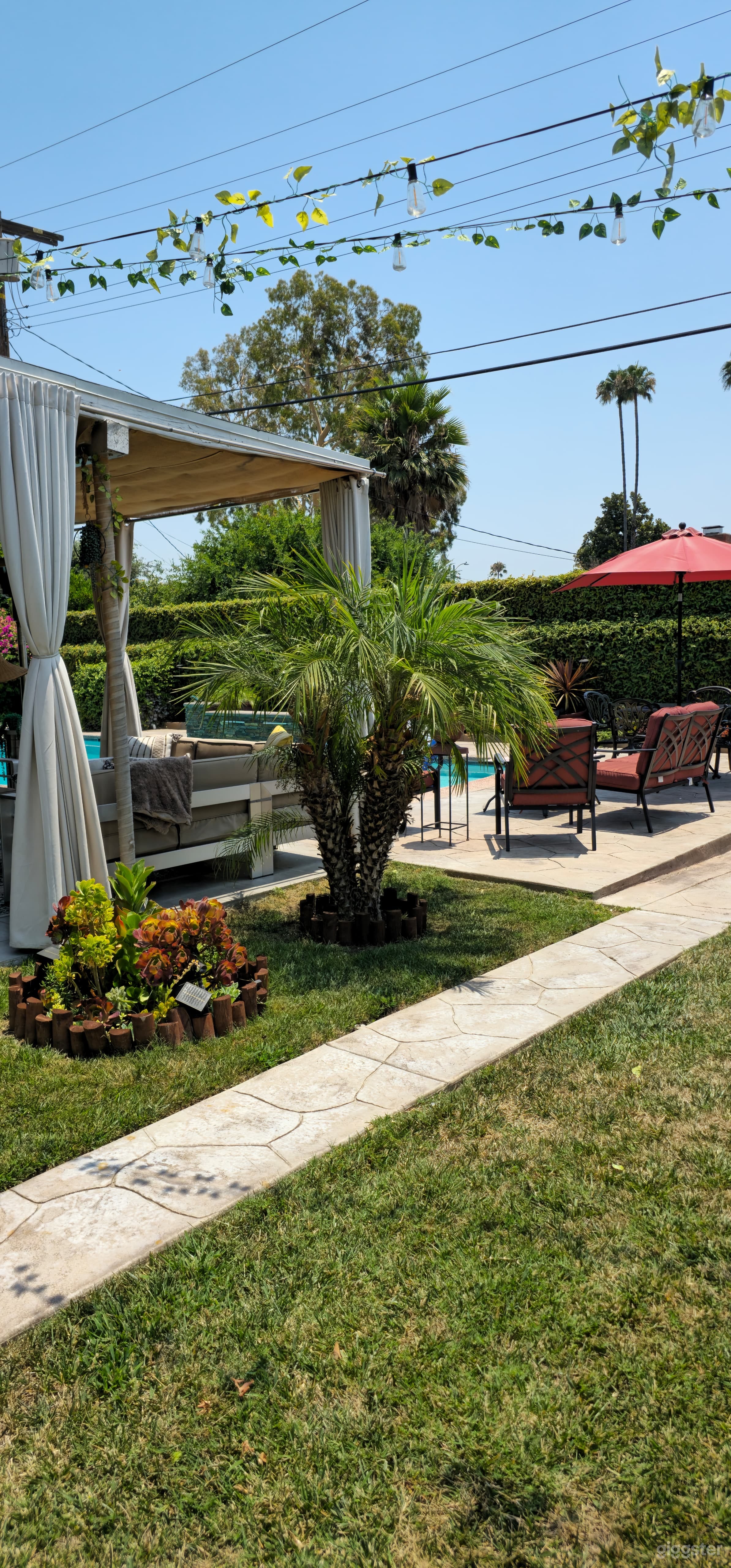 Spacious Outdoor Party Space With Sparkling Pool Photo 3