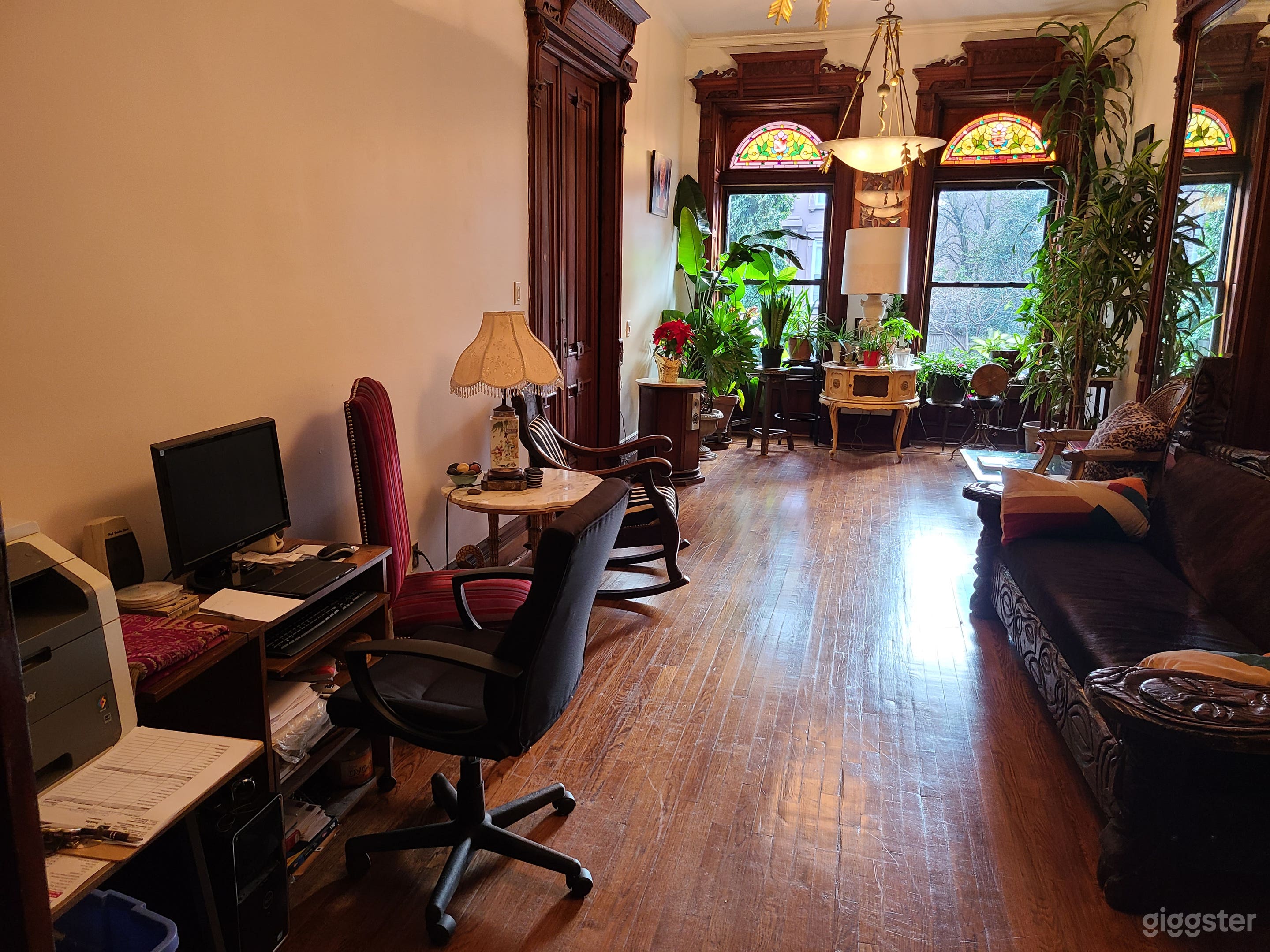 Bright living room with hardwood floors &amp; computer area.