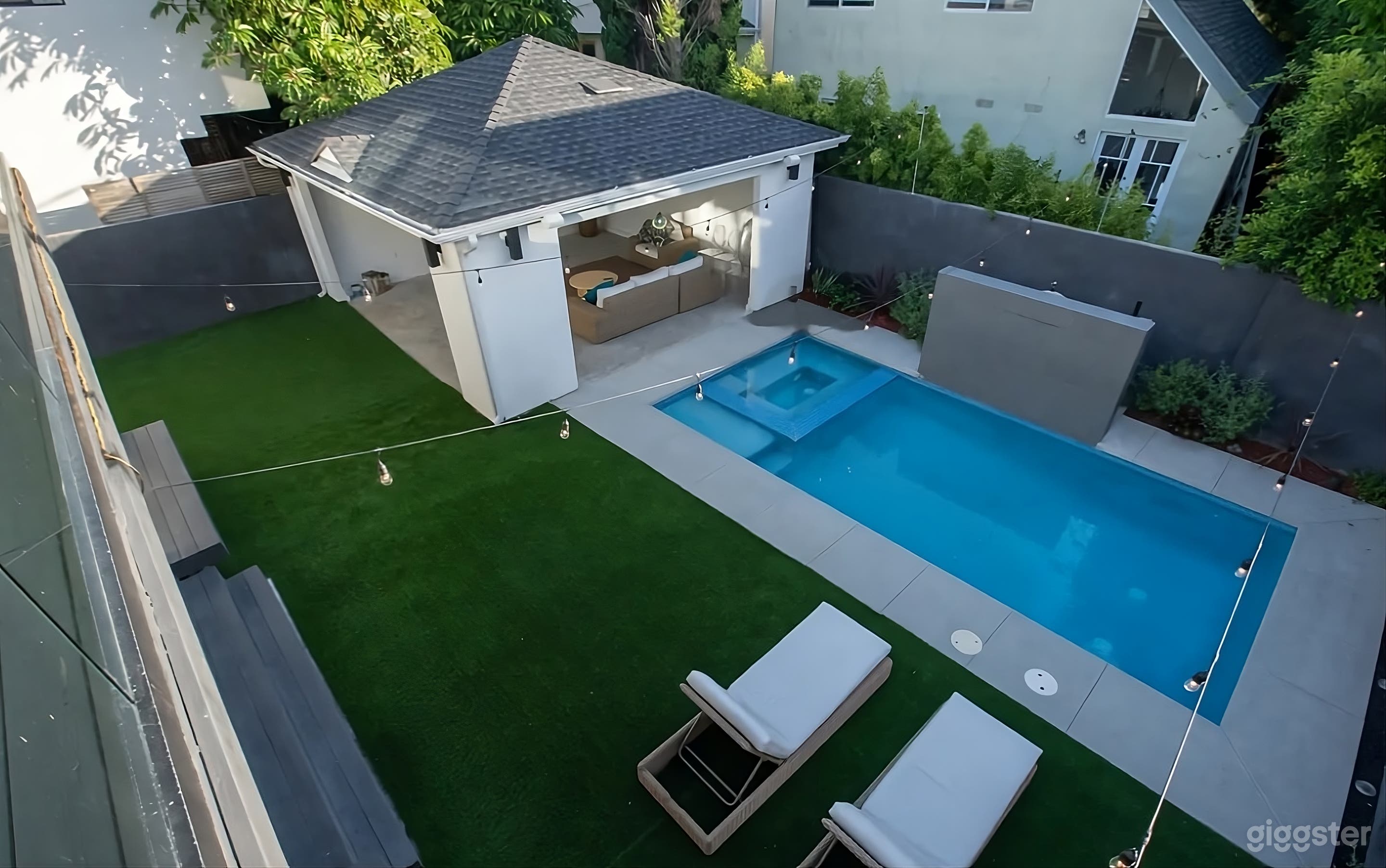 Luxurious Modern Backyard Oasis with Pool Photo 4