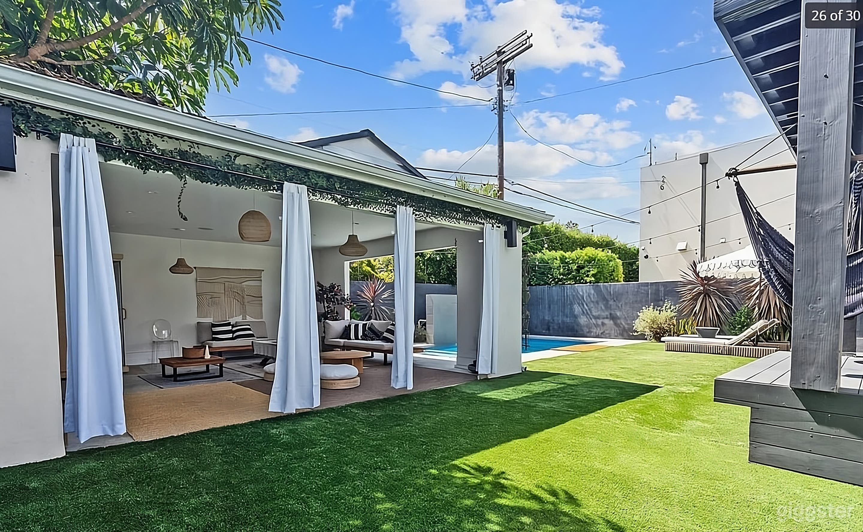 Luxurious Modern Backyard Oasis with Pool Photo 3