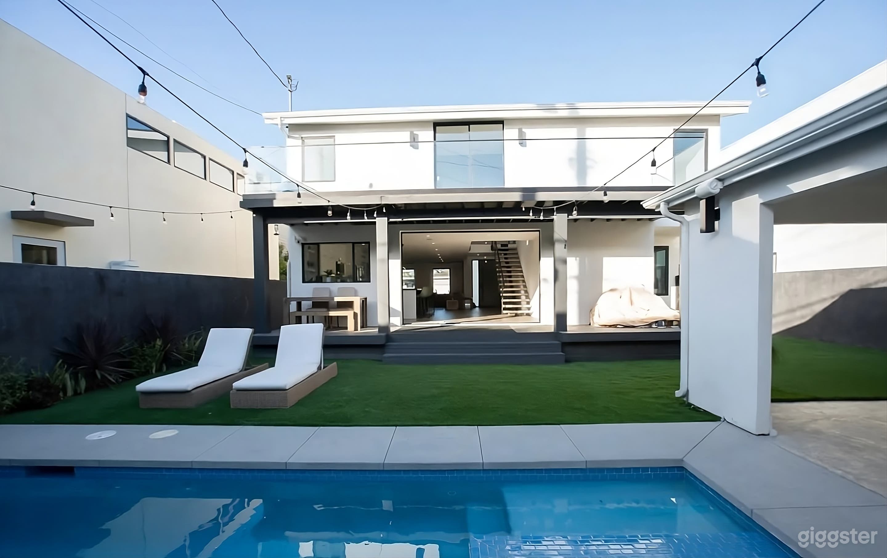 Luxurious Modern Backyard Oasis with Pool Photo 1