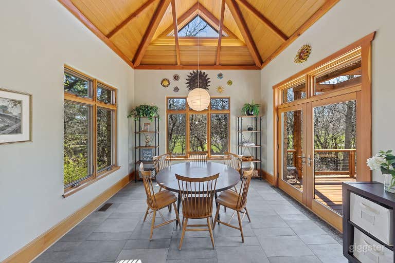  Sunny Breakfast Room with south, east and west exposures, vaulted ceiling, access to deck and vaulted ceiling. 