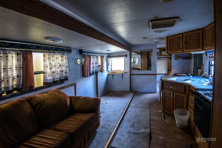  Interior of what looks like it could be the Breaking Bad conditioned tailor. 
There are other curtains. trailer can be positioned in several places in the yard. 
