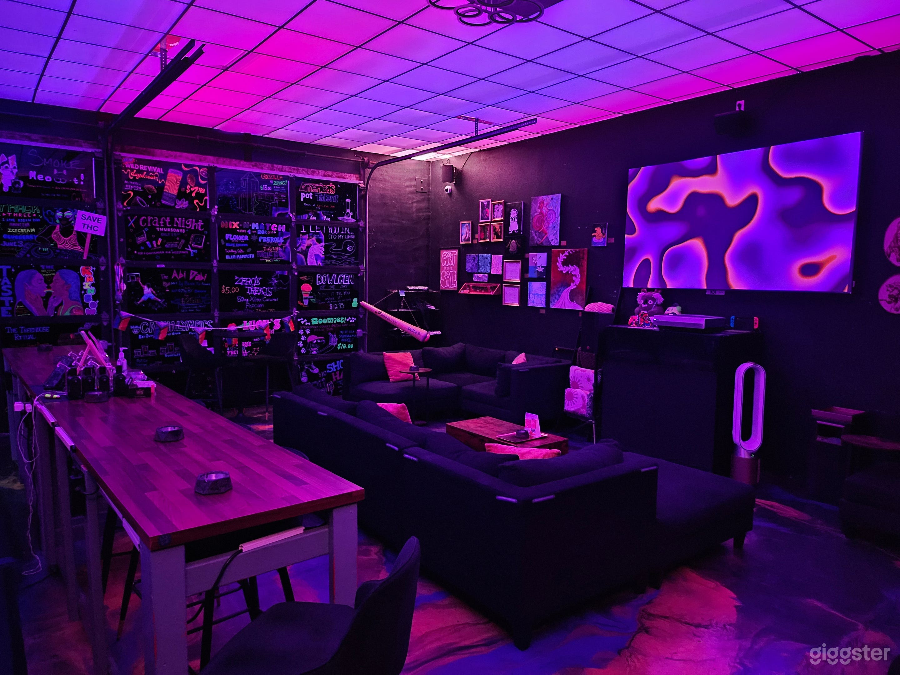 Downtown neon-lit lounge with a modern, immersive atmosphere Photo 1
