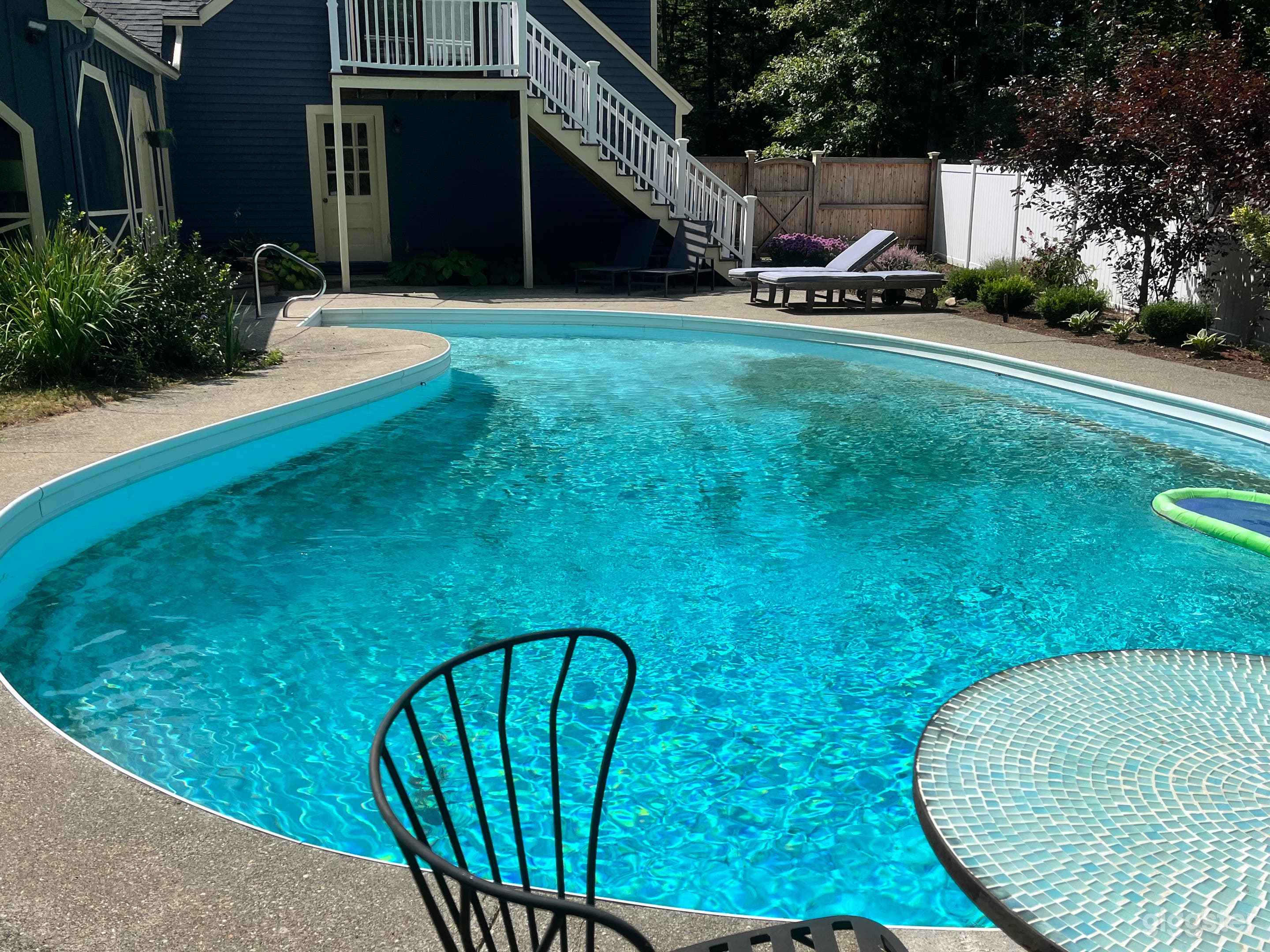 Serene English Garden Pool with Three-Season Porch Photo 2
