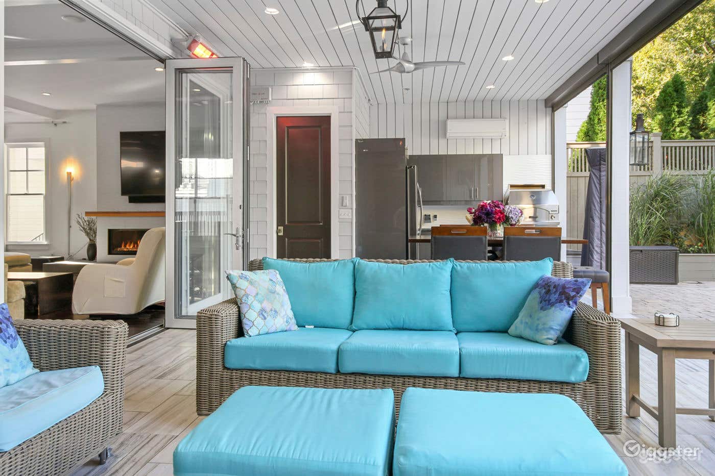 Attached patio with automatic screens welcome guests into this backyard escape