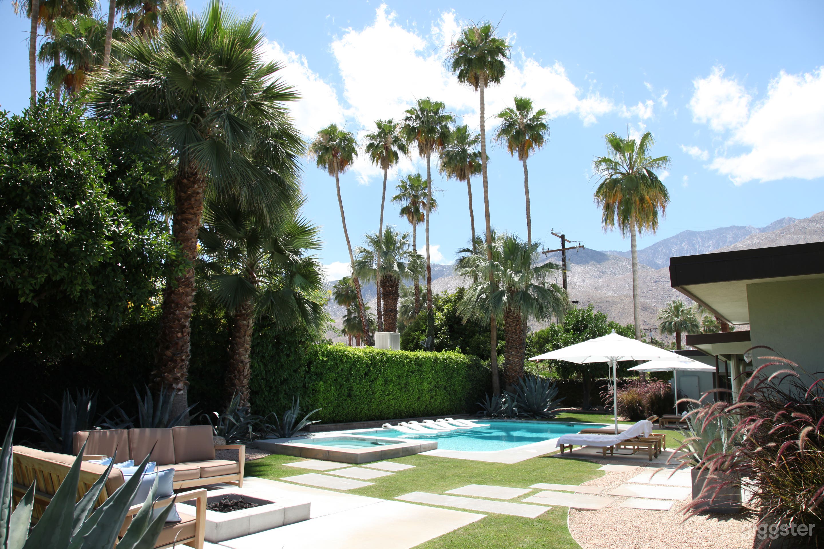 The property has a huge backyard with pool, spa, fire pit and grassy areas.  All with views of the mountains in the distance.
