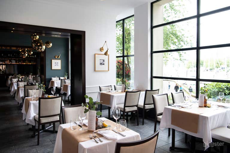  View to small boat marina, false creek, Burrard Street Bridge, Granville Island sign, downtown skyline, mountain 