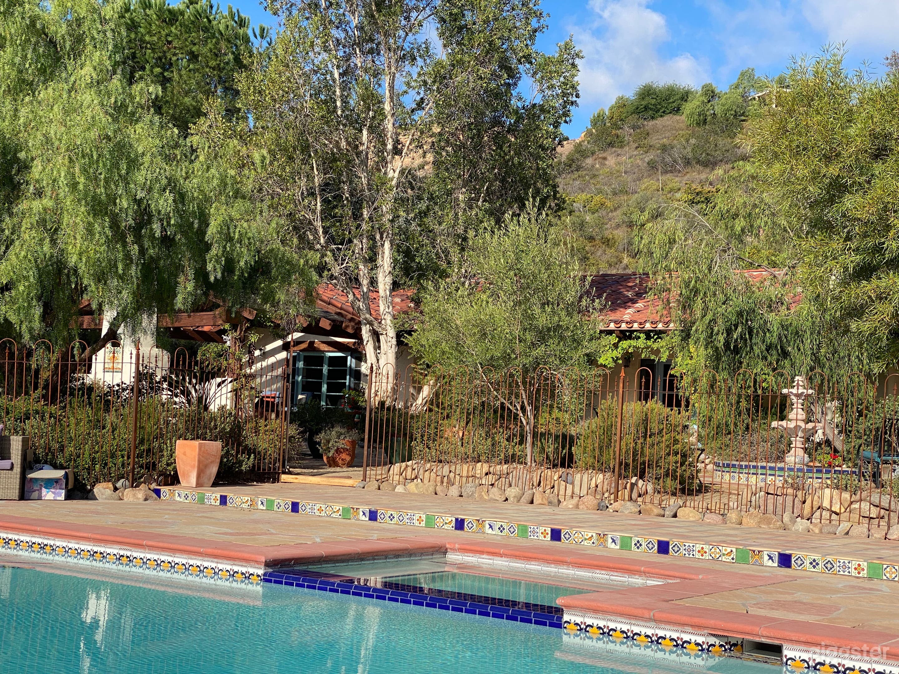 Spanish-Style Horse Ranch With Pool and View Photo 3