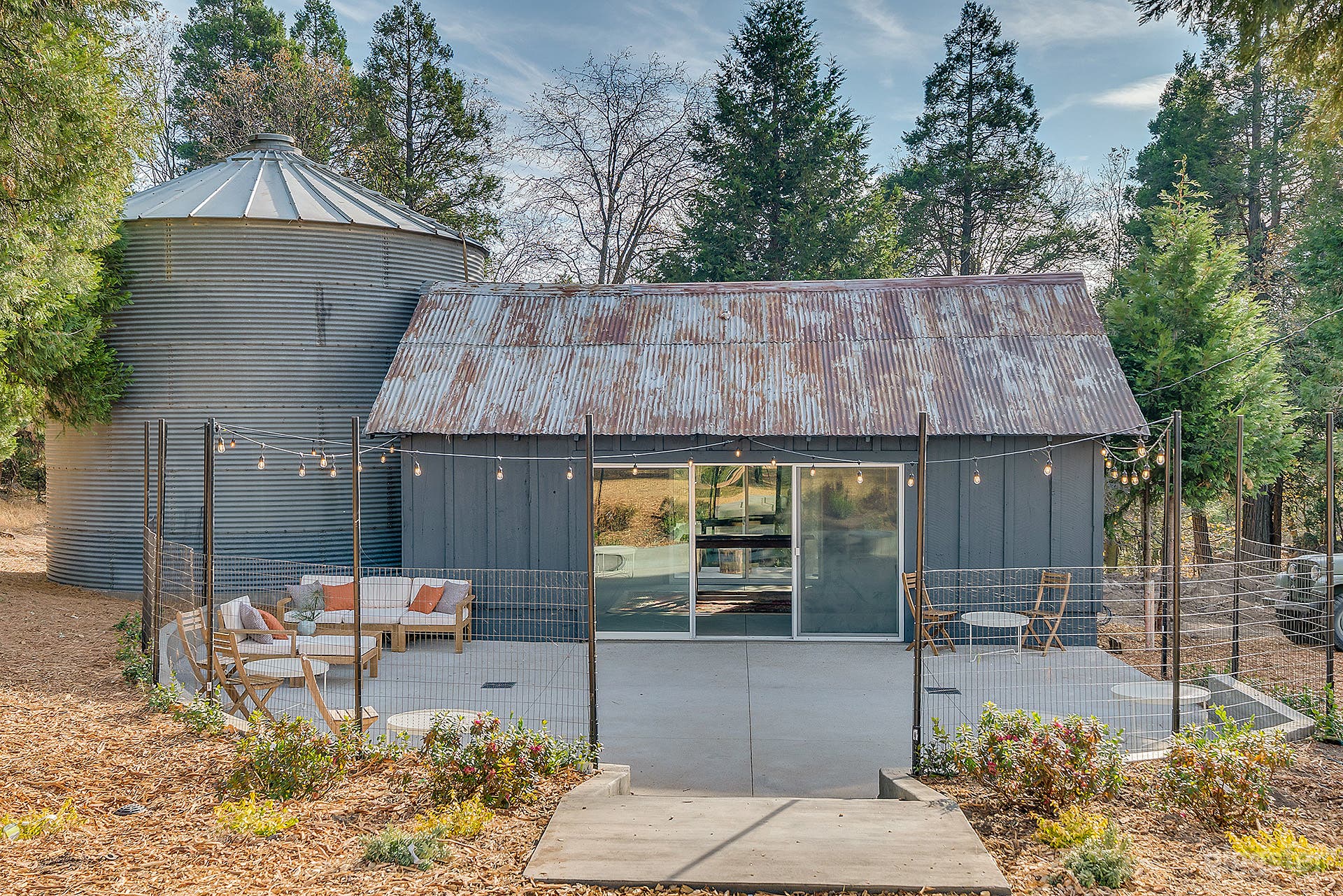 Barn with open outside area which has covered fire pit and 2 BBQs.  Tables and chairs. Truck can drive right up to it. Sorry - silo anymore :-(.  Instead we now have an area with covered outdoor fire pit 