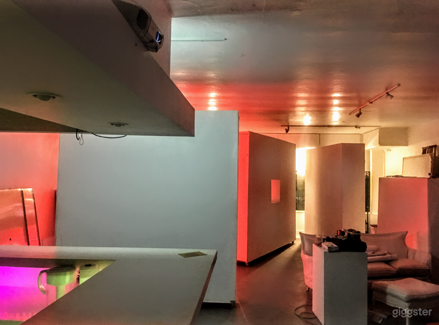 Moveable white walls on wheels in Main Studio Area/Art Gallery with polished concrete floors. All furniture is movable 