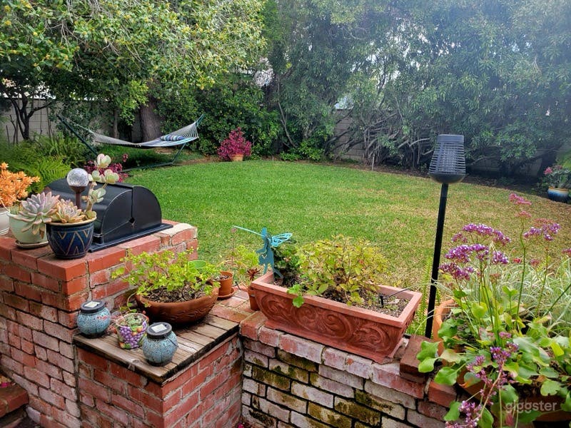 Romantic Garden and Lush Backyard Haven Photo 1