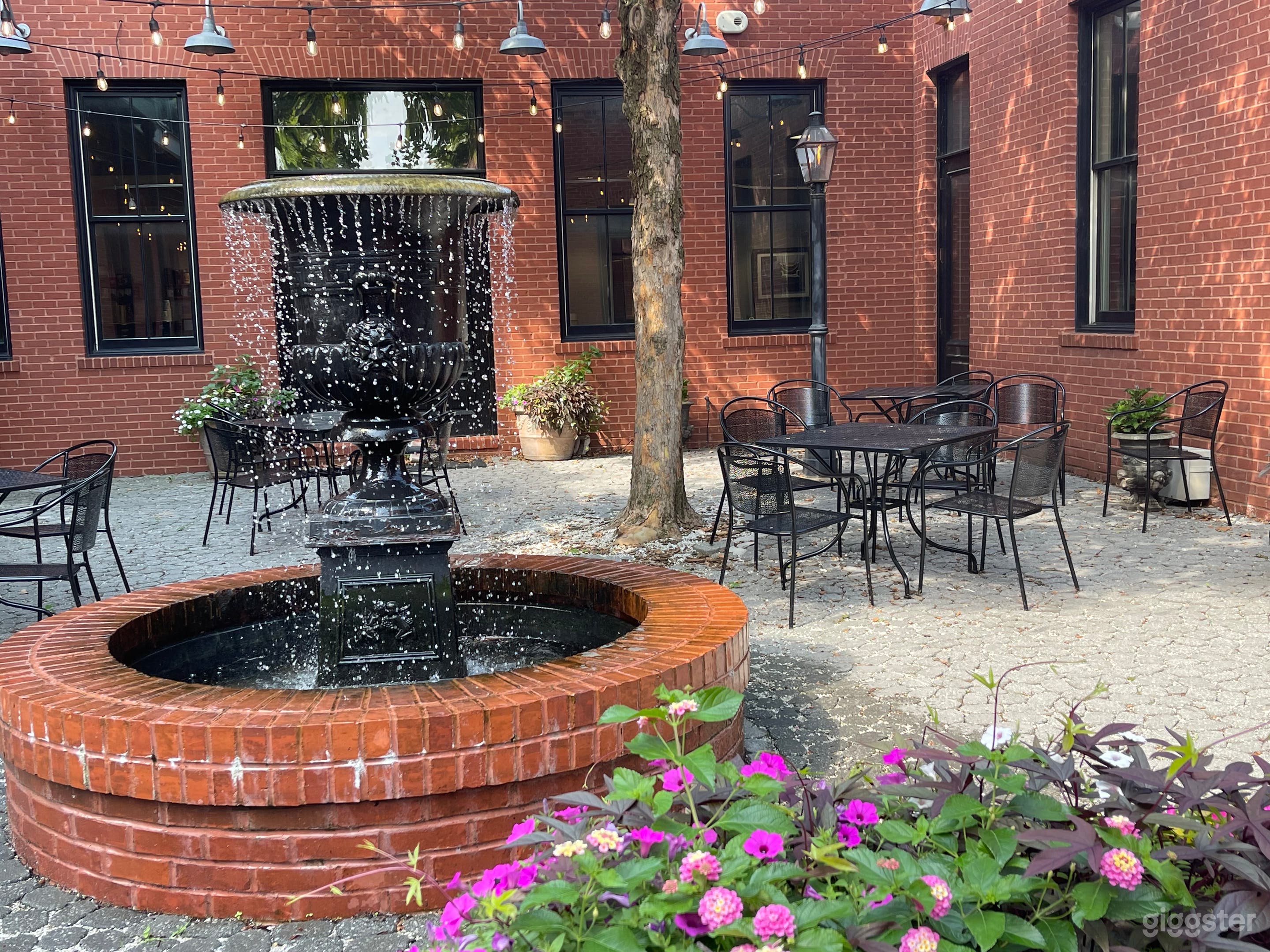 A beautiful fountain is the center of the space and adds a peaceful ambient to the vibe.