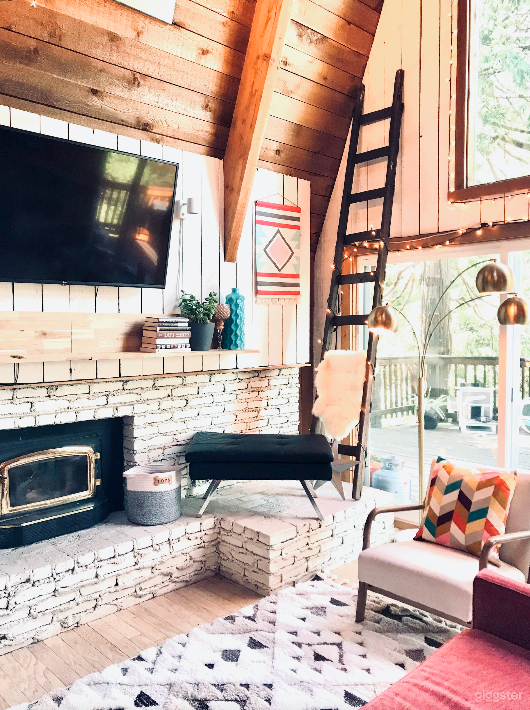 Cozy Living Room with a beautiful Mid- Century Modern fireplace and floor to ceiling windows.
