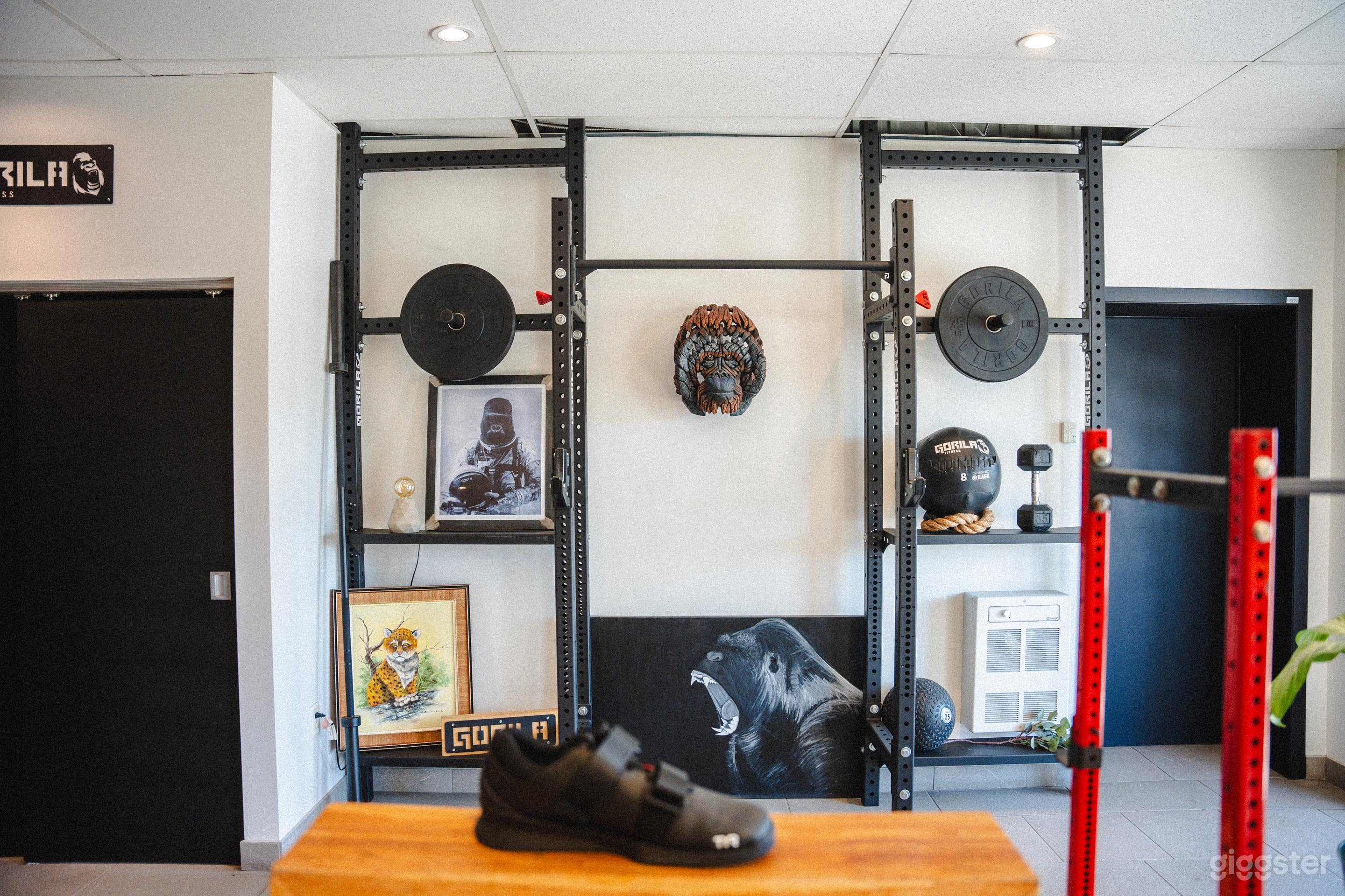 The entryway offers a relaxing chill zone with benches and retro gaming consoles like Nintendo 64 and GameCube, providing a fun and welcoming atmosphere.