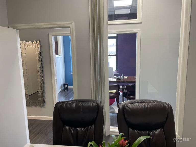  Conference room with interior windows and hallway view — offers privacy with visibility, perfect for team shoots or filmed meetings. 