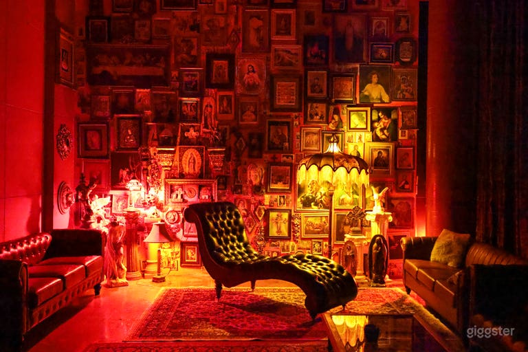  Curvy leather couch in front of the Jesus Wall 