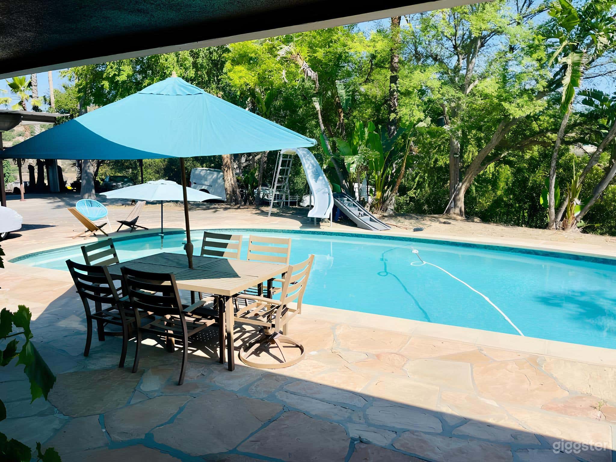 In-Ground Pool with Lounge Chairs and Shaded Areas Photo 2