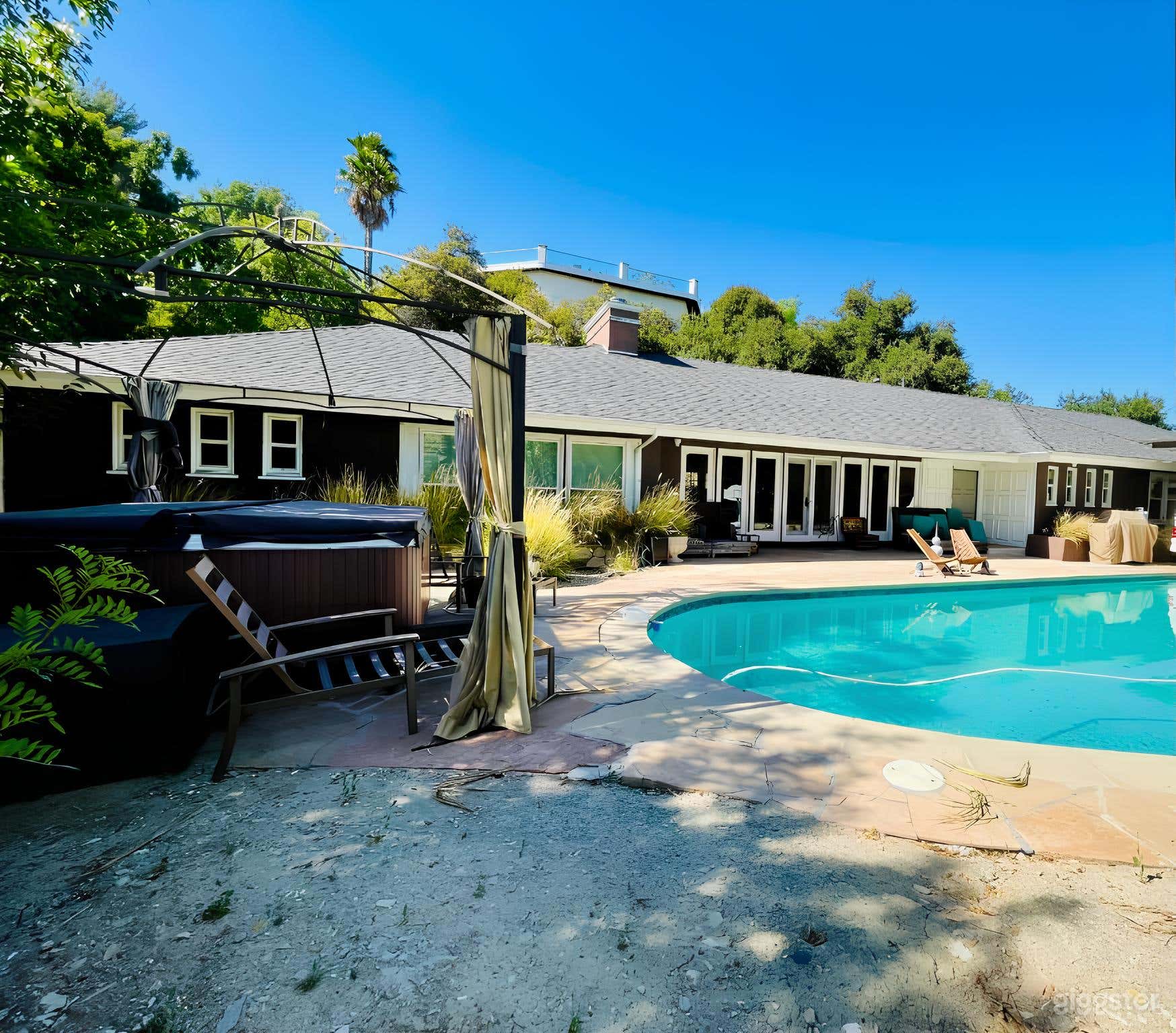 In-Ground Pool with Lounge Chairs and Shaded Areas Photo 3