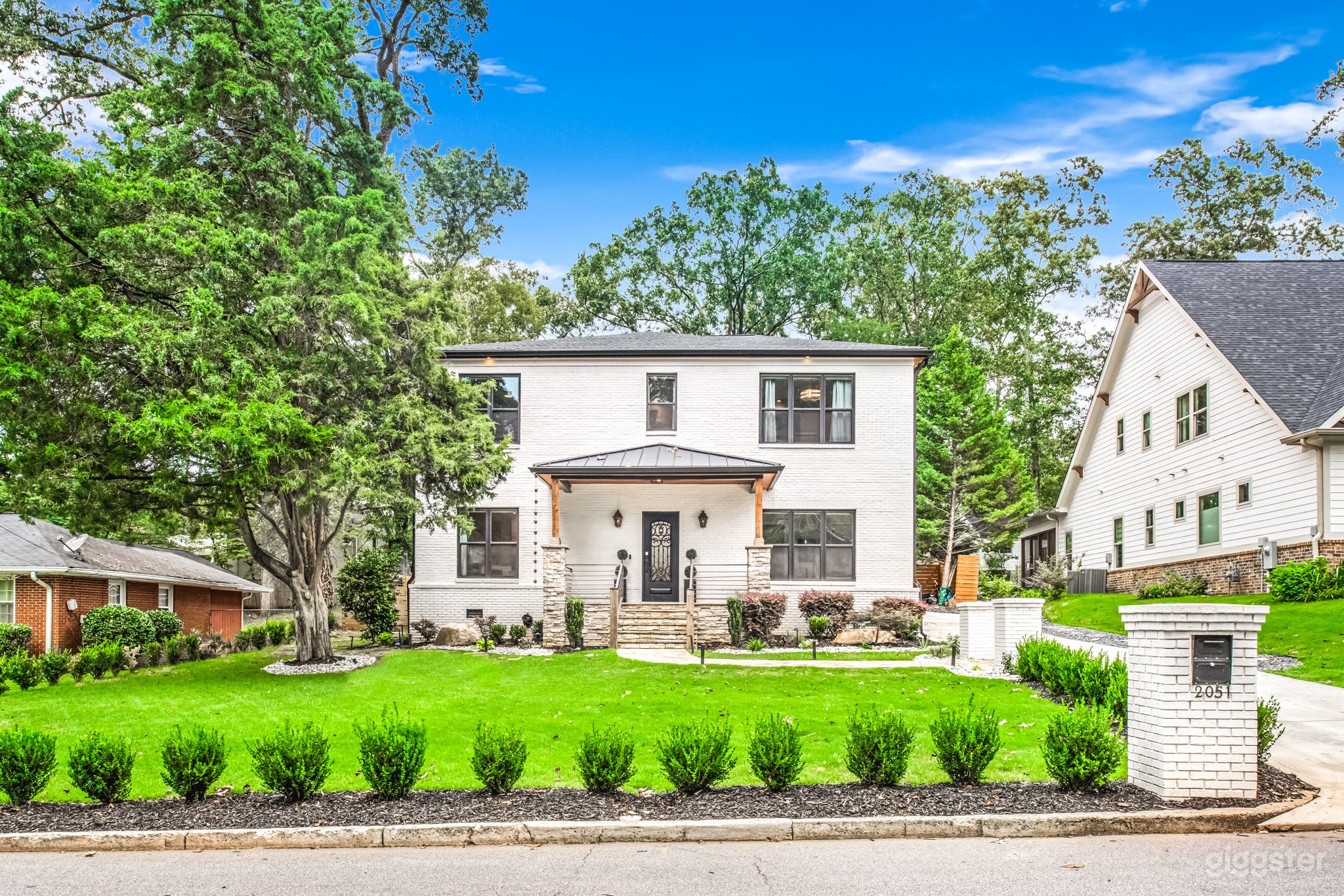 Modern White Brick Home with Outdoor Pool Oasis Photo 1