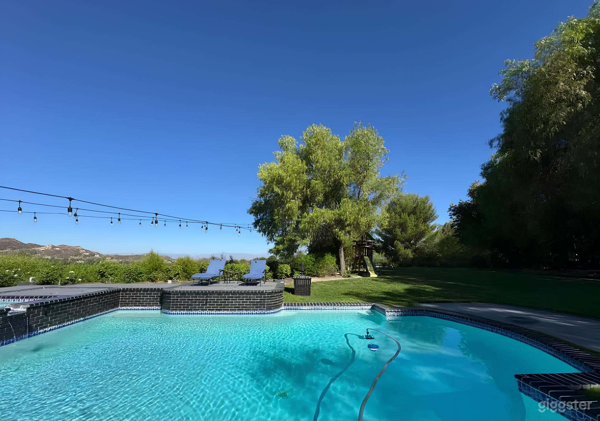 Gorgeous Pool Surrounded by Mountains Photo 1