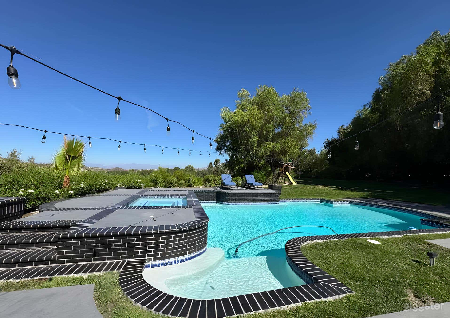 Gorgeous Pool Surrounded by Mountains Photo 3