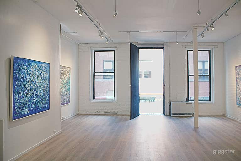  A distinctive oversized window that once served as a hay-loading opening in the building’s carriage-house days. It brings historic charm and natural light into the clean, modern space. 