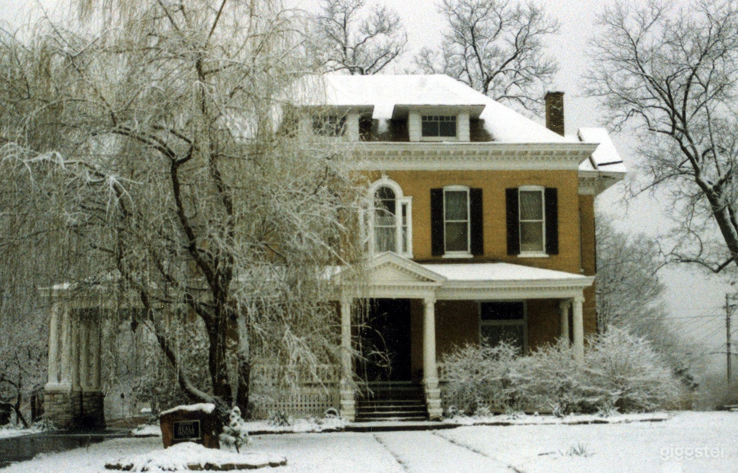 Front view of The BEALL MANSION in the snow