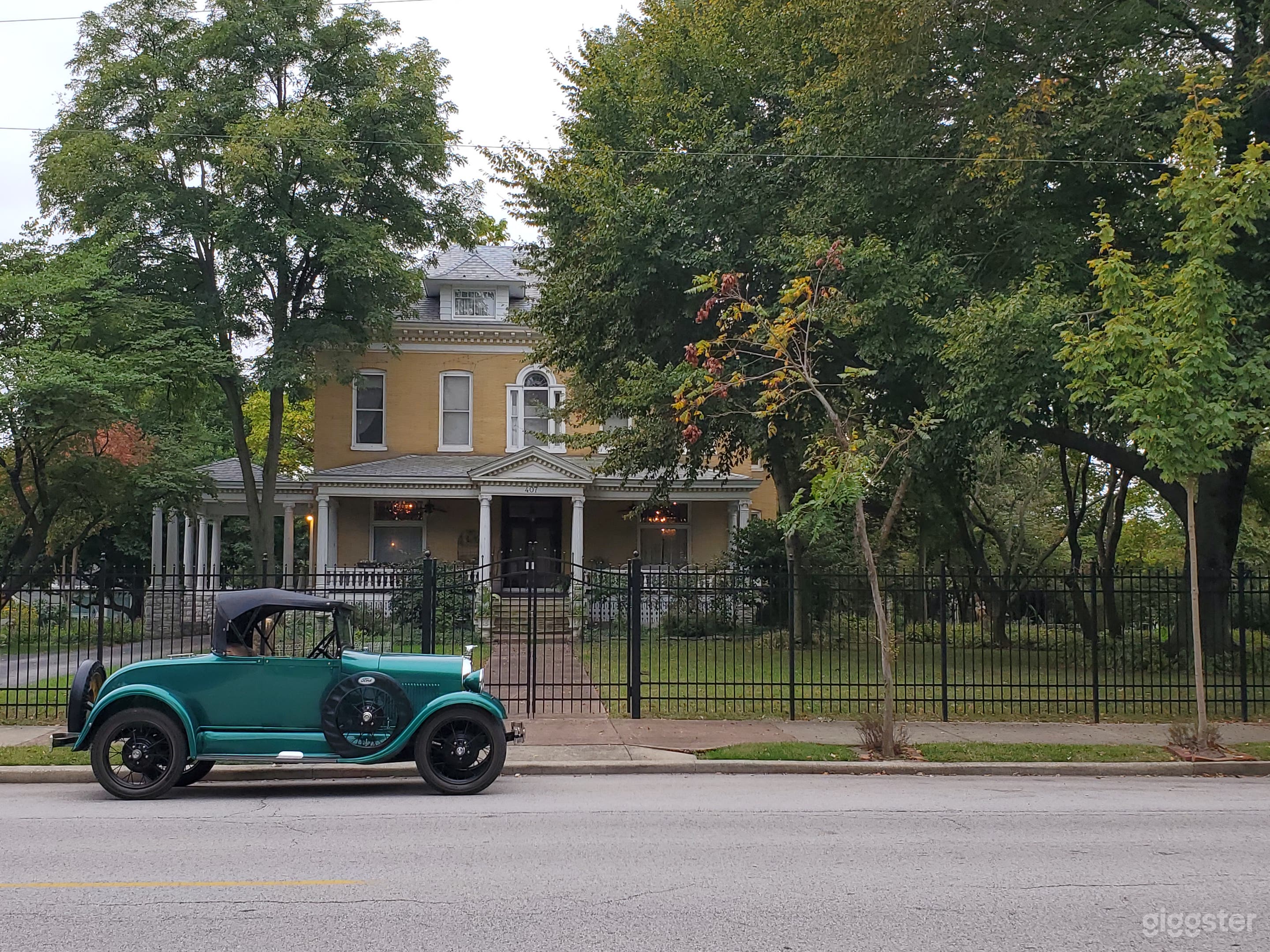 Model A Ford on East 12th Street in front of The BEALL MANSION