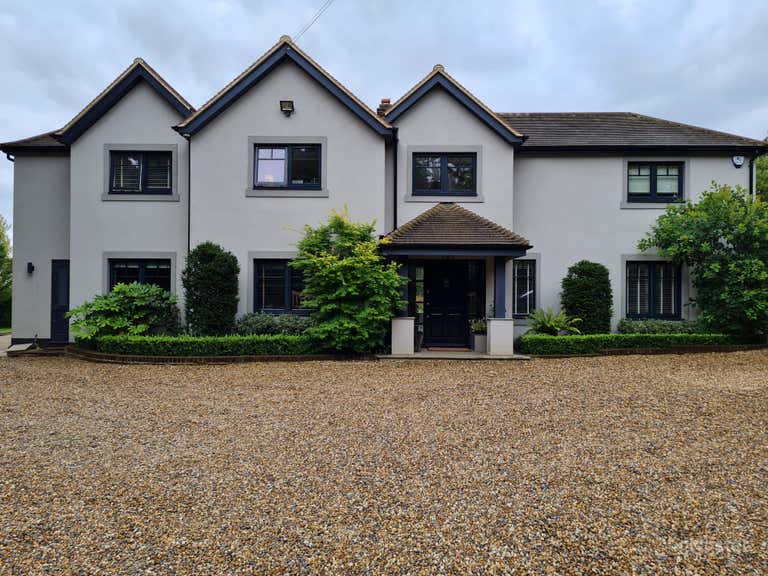  Front of Three Gabels with gravel drive 