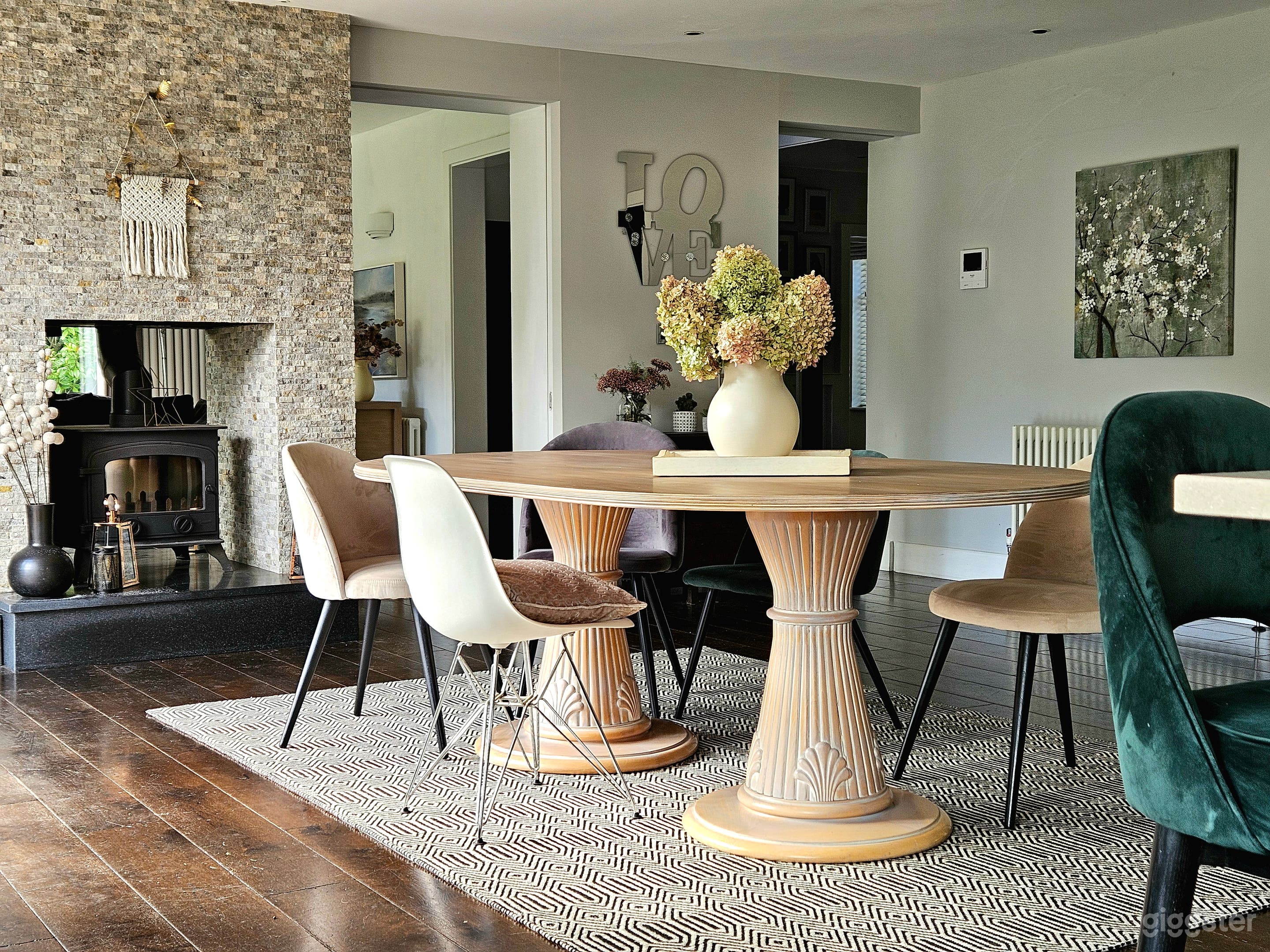 Open plan kitchen diner with woodburning double-sided stove

