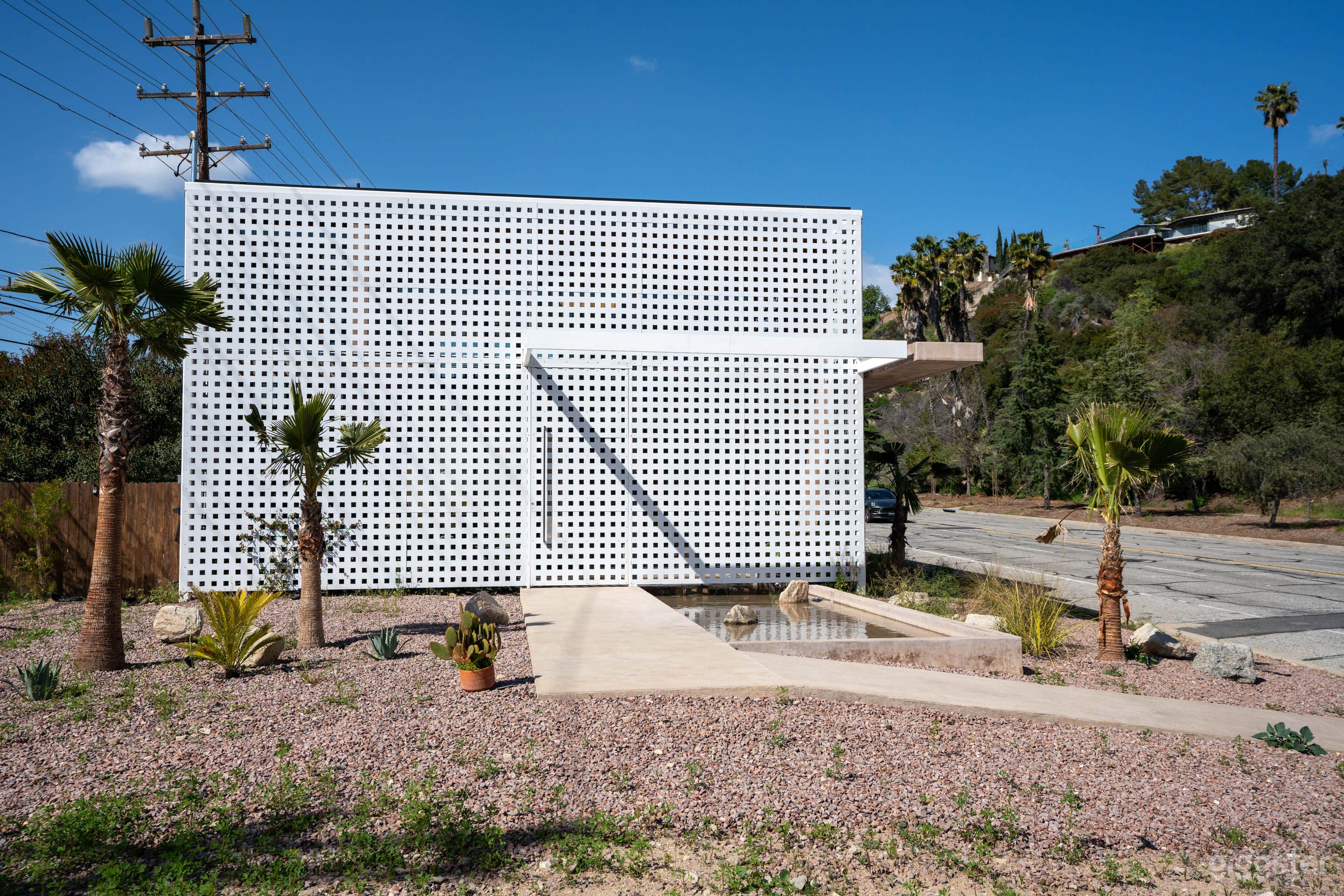 Concrete Oasis: A Villa Retreat with Poolside Serenity Photo 1