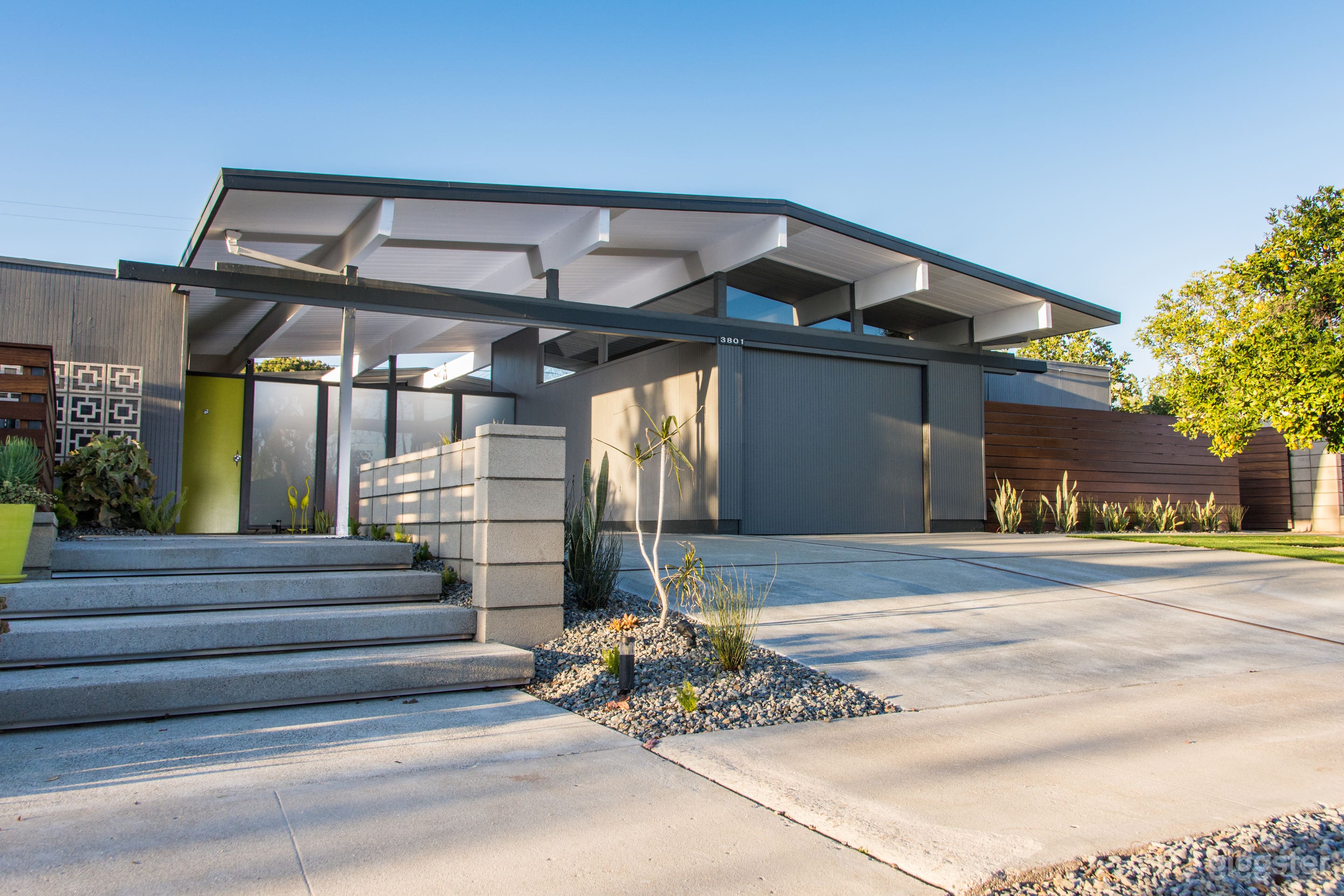 Both front exterior and backyard feature breeze block