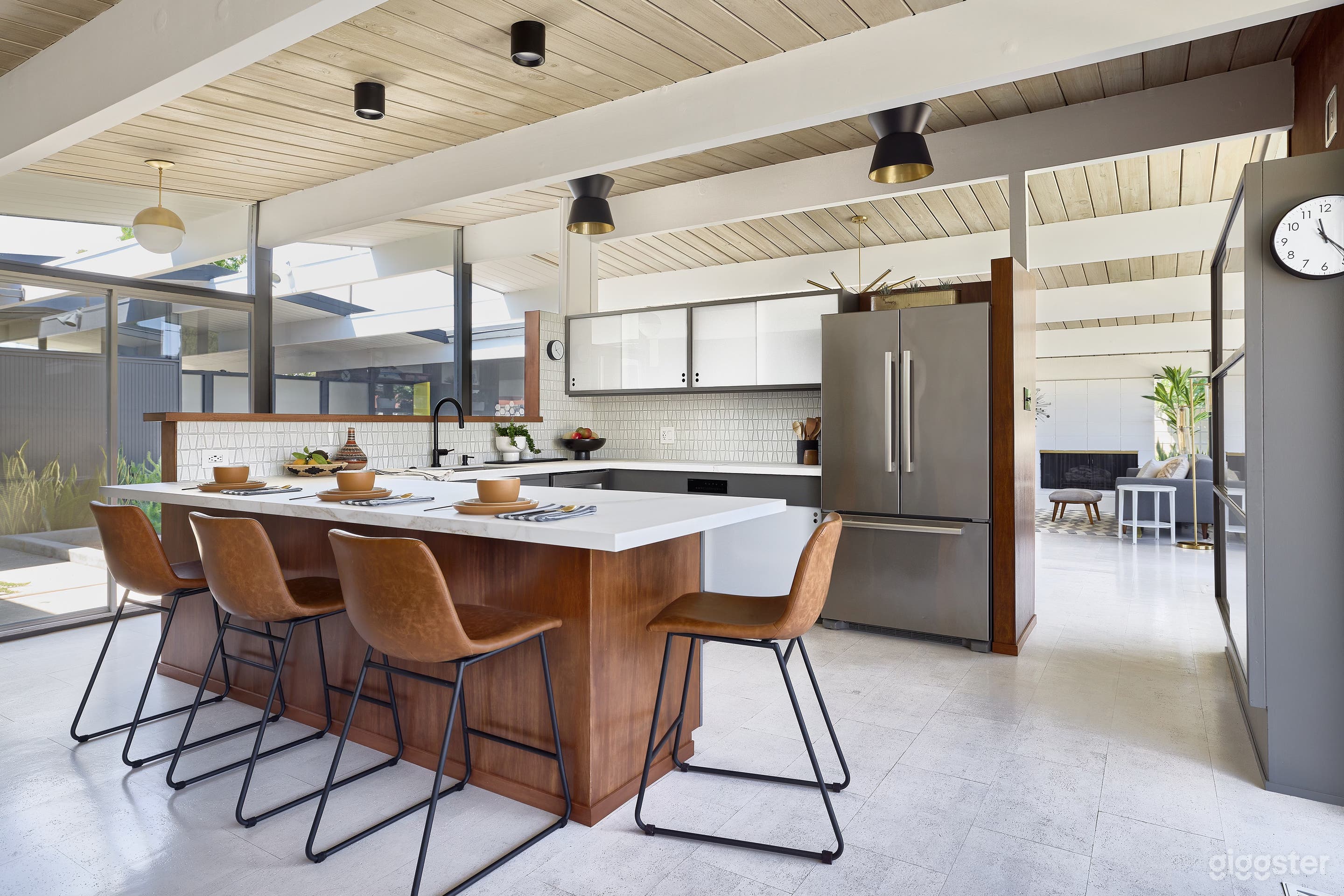 Original cabinetry in the kitchen with renovated tile, new drawers on opposite side, porcupine countertops and an Invisacook induction cooktop
