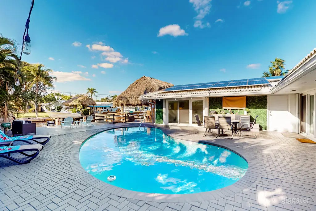 Waterfront Tropical Retreat | Pool, Tiki Bar & Sunset Views Photo 3