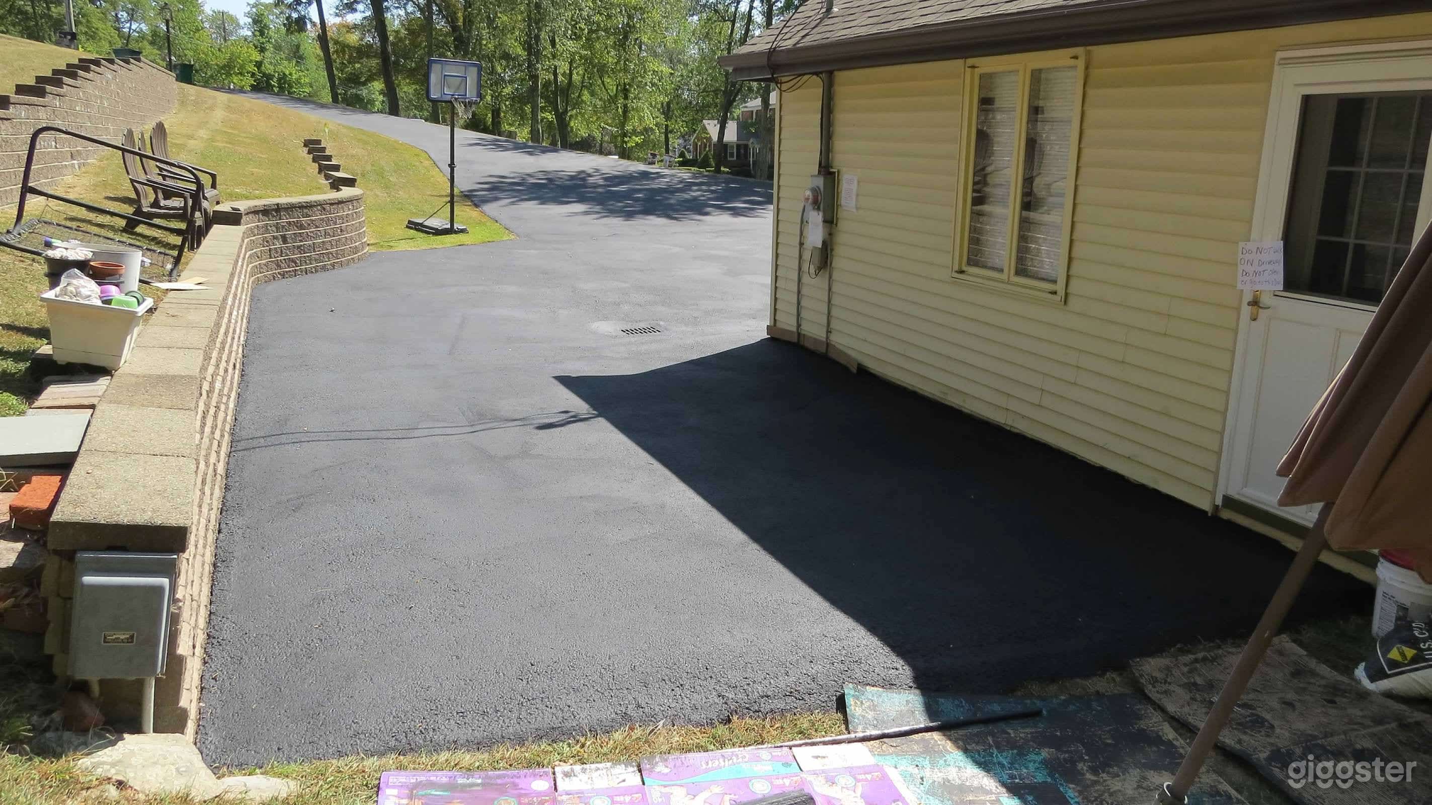 side of driveway where RV or mobile home can set up. also access to garage