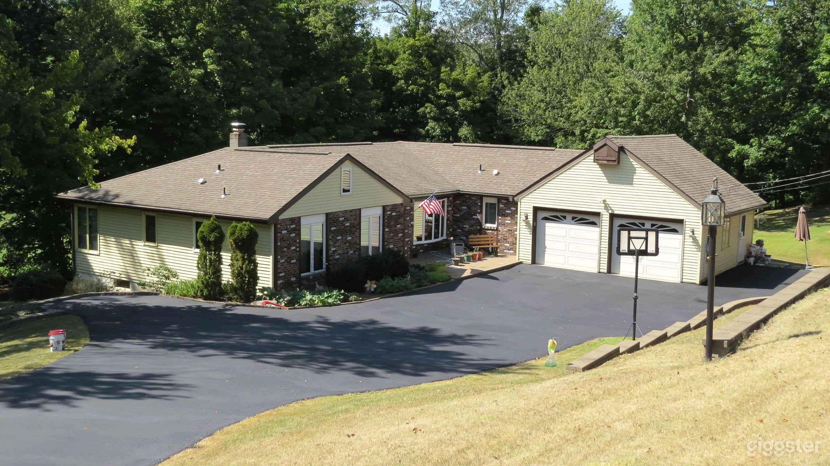 driveway set back and down from road. very private