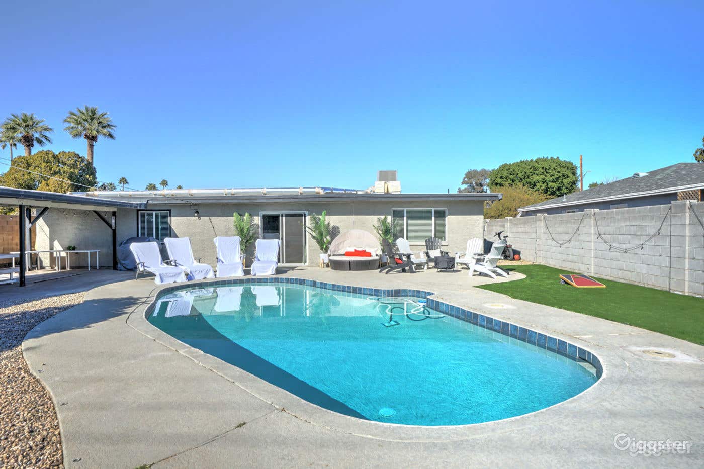 Bright Pool Area with Beautiful Backyard Photo 2