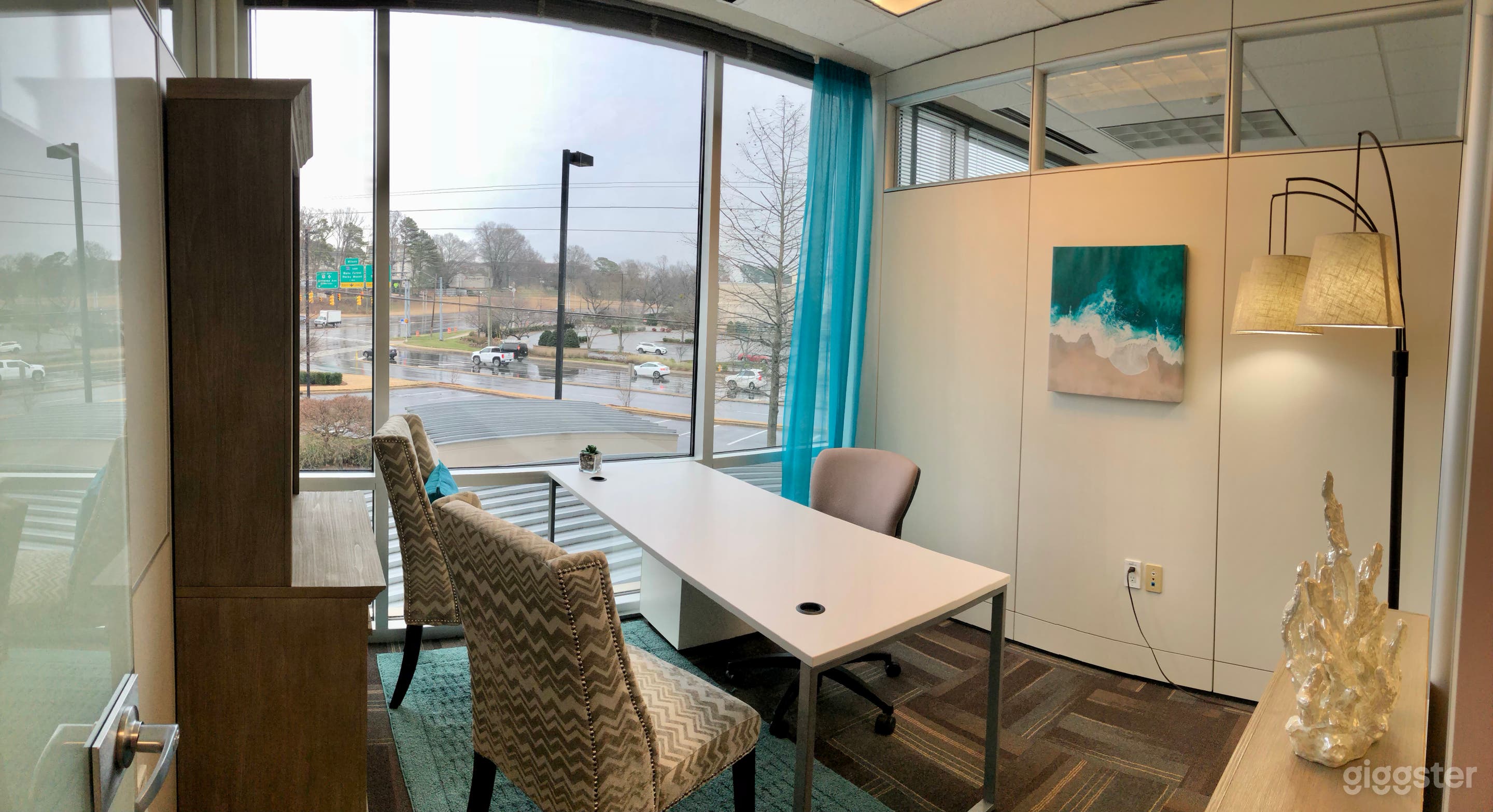 Exterior office, morning light, facing intersection. 