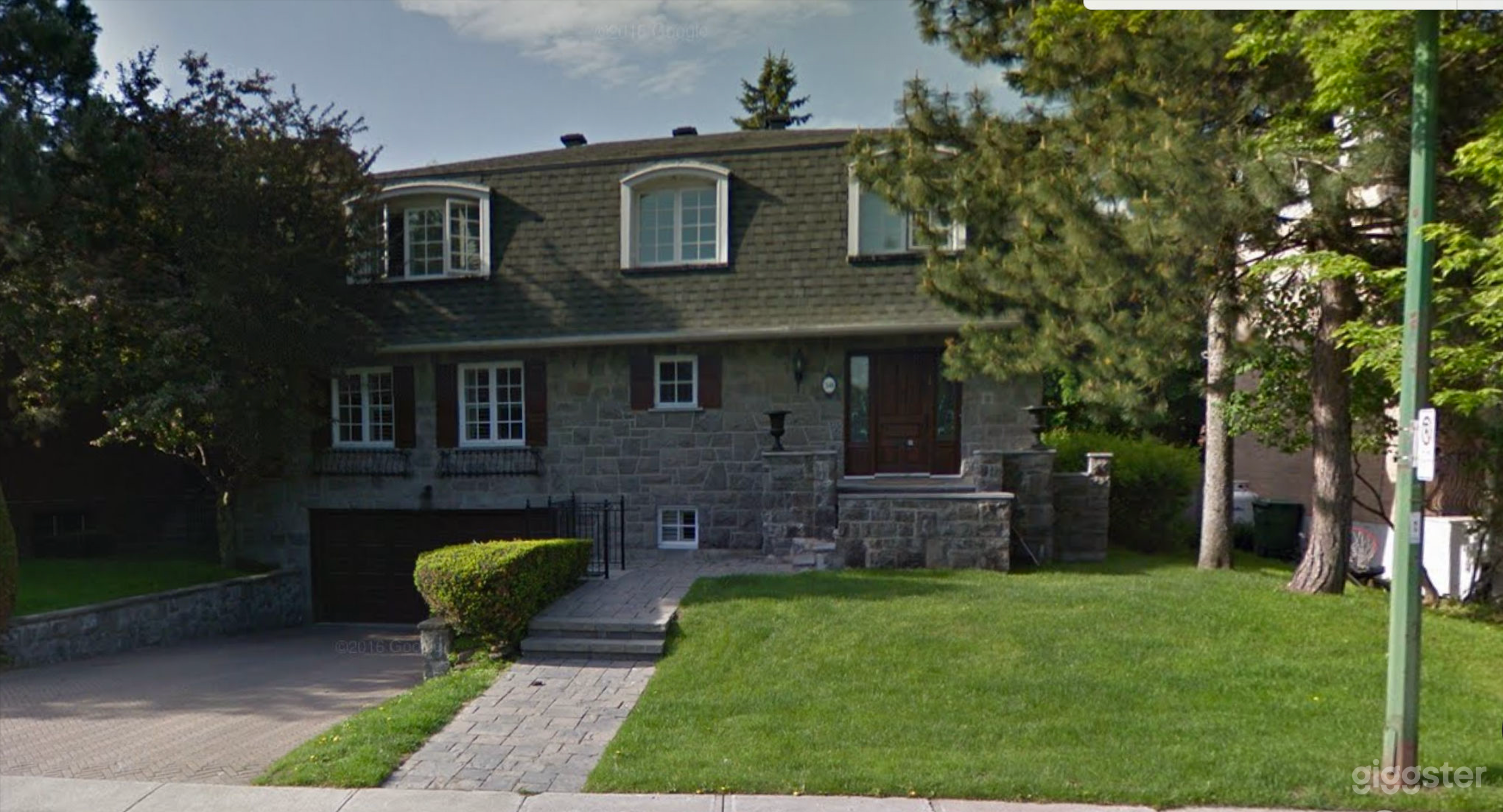 Discretely luxurious grey stone home Photo 1