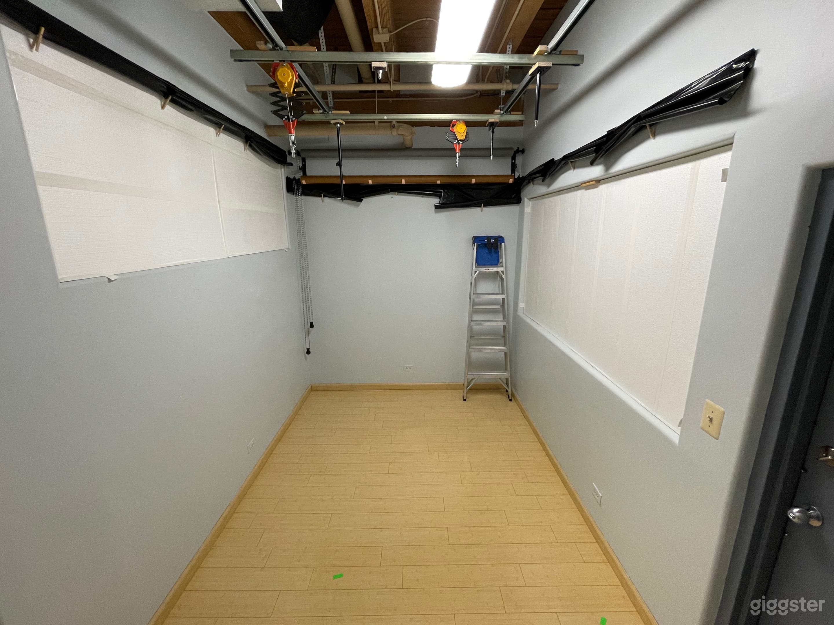 Dedicated shooting space equipped with an assortment of color backdrops and light mounting rigs.