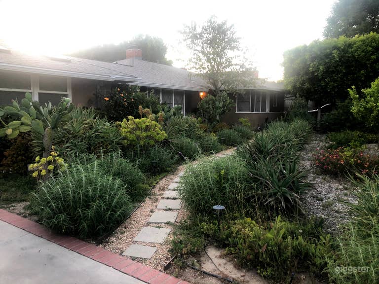  1950 s ranch house with a huge yard, pool, garden 